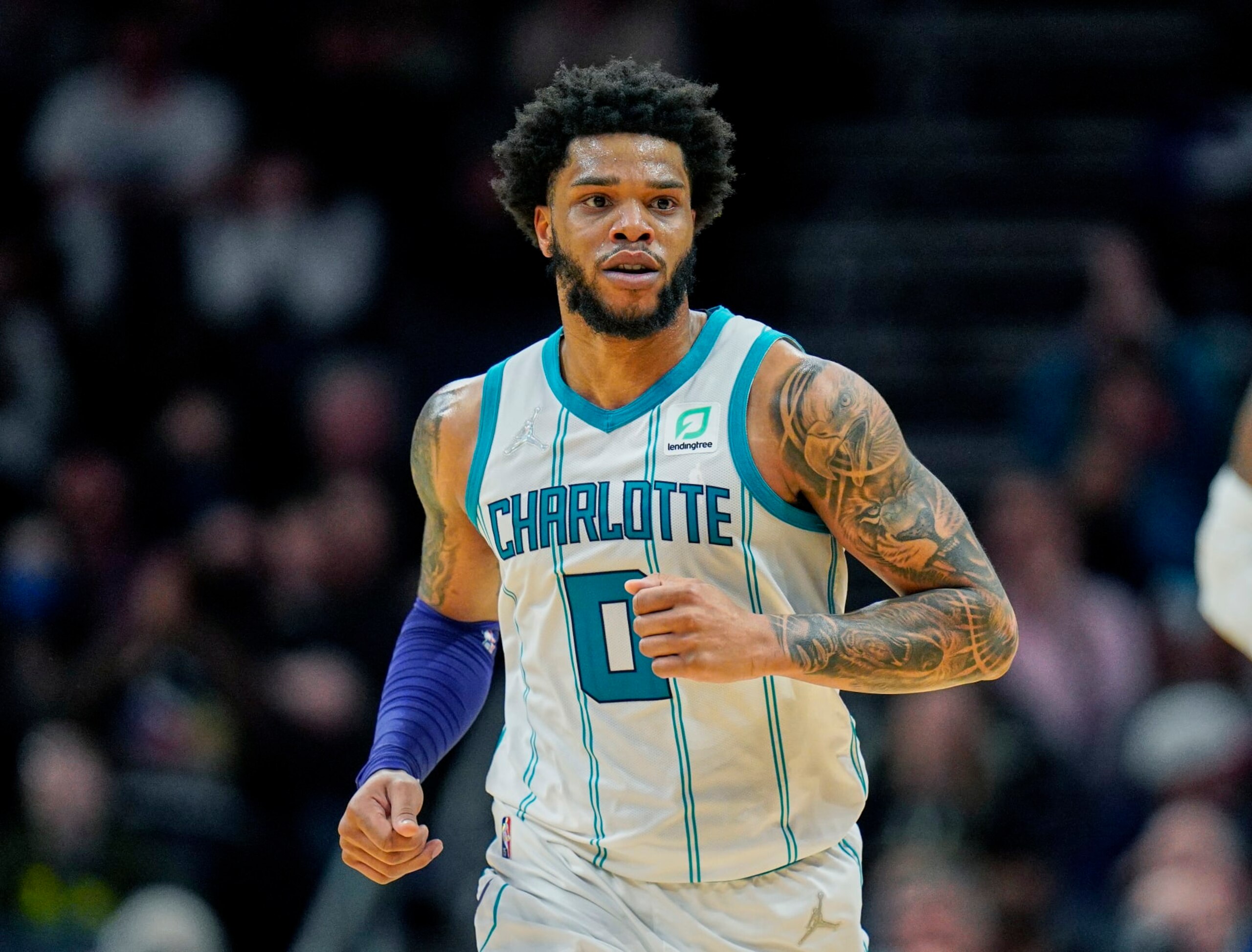 FILE - Charlotte Hornets forward Miles Bridges (0) moves up court during an NBA basketball game against the Denver Nuggets on Monday, March 28, 2022, in Charlotte, N.C. Hornets forward Miles Bridges was arrested Wednesday, June 29, 2022, in Los Angeles after a warrant was issued, according to the Los Angeles Police Department. The details of the arrest and the charges were not immediately available. (AP Photo/Rusty Jones, File)