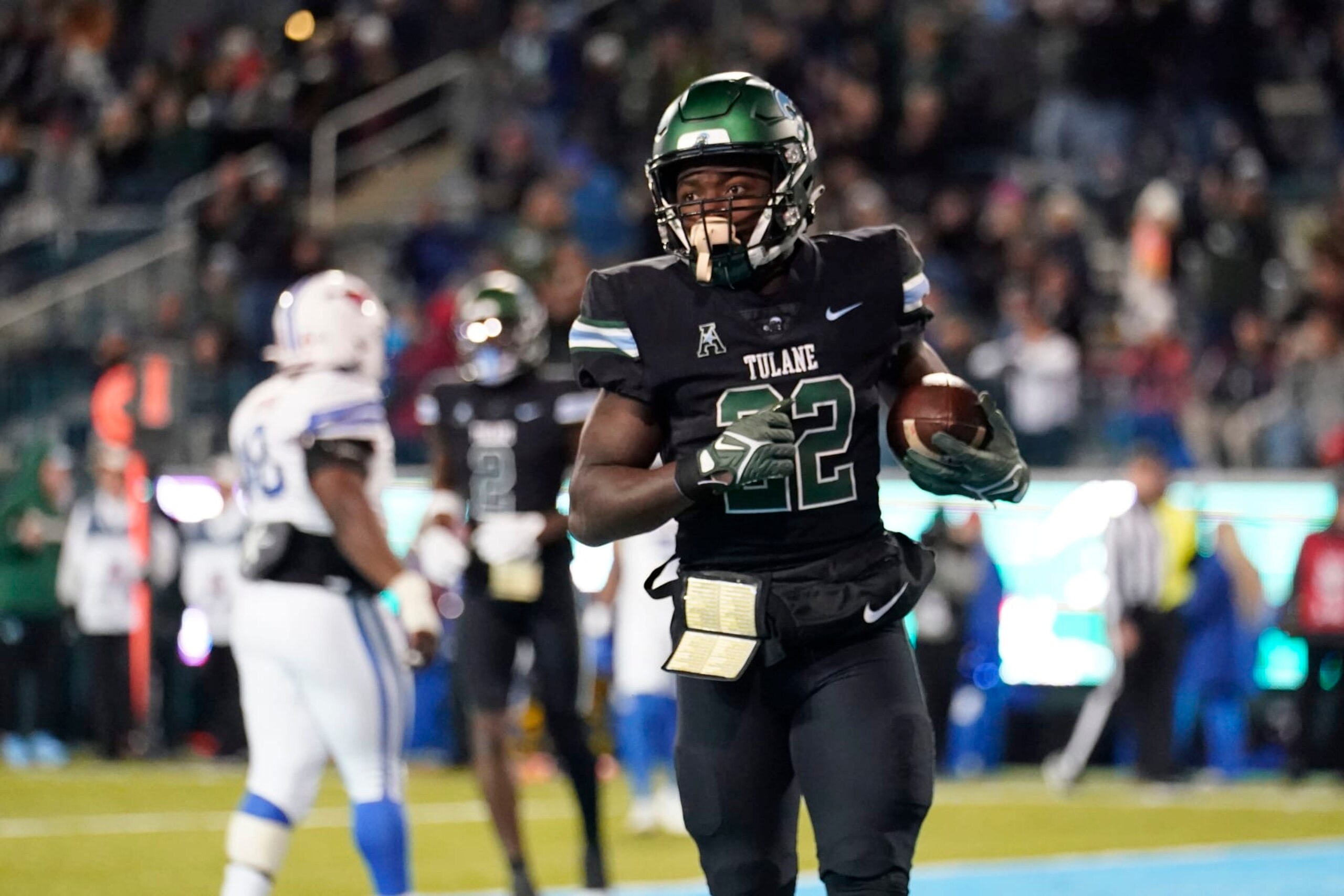 Tulane running back Tyjae Spears (22) scores a touchdown during the second half of an NCAA college football game against Southern Methodist in New Orleans, Thursday, Nov. 17, 2022. Tulane won 59-24. (AP Photo/Gerald Herbert) Tulane running back Tyjae Spears (22) scores a touchdown during the second half of an NCAA college football game against Southern Methodist in New Orleans, Thursday, Nov. 17, 2022. Tulane won 59-24. (AP Photo/Gerald Herbert)