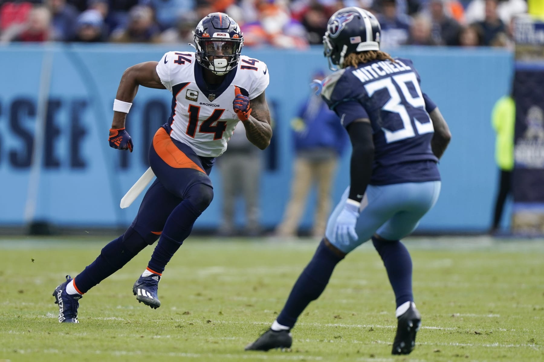 Denver Broncos wide receiver Courtland Sutton (14) runs a route against Tennessee Titans cornerback Terrance Mitchell (39) during the first half of an NFL football game, Sunday, Nov. 13, 2022, in Nashville, Tenn. (AP Photo/Mark Humphrey)