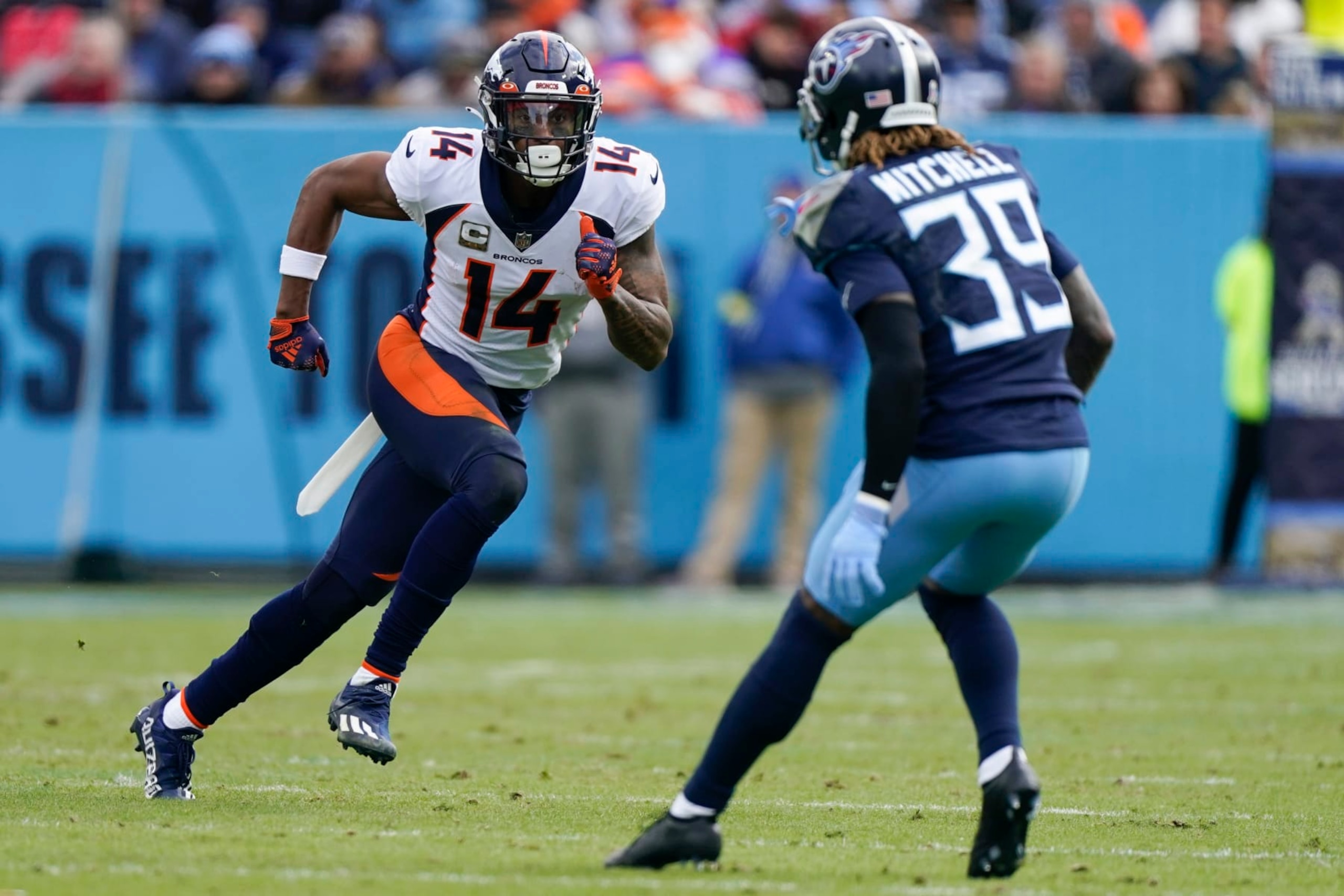 Denver Broncos wide receiver Courtland Sutton (14) runs a route against Tennessee Titans cornerback Terrance Mitchell (39) during the first half of an NFL football game, Sunday, Nov. 13, 2022, in Nashville, Tenn. (AP Photo/Mark Humphrey) Denver Broncos wide receiver Courtland Sutton (14) runs a route against Tennessee Titans cornerback Terrance Mitchell (39) during the first half of an NFL football game, Sunday, Nov. 13, 2022, in Nashville, Tenn. (AP Photo/Mark Humphrey)