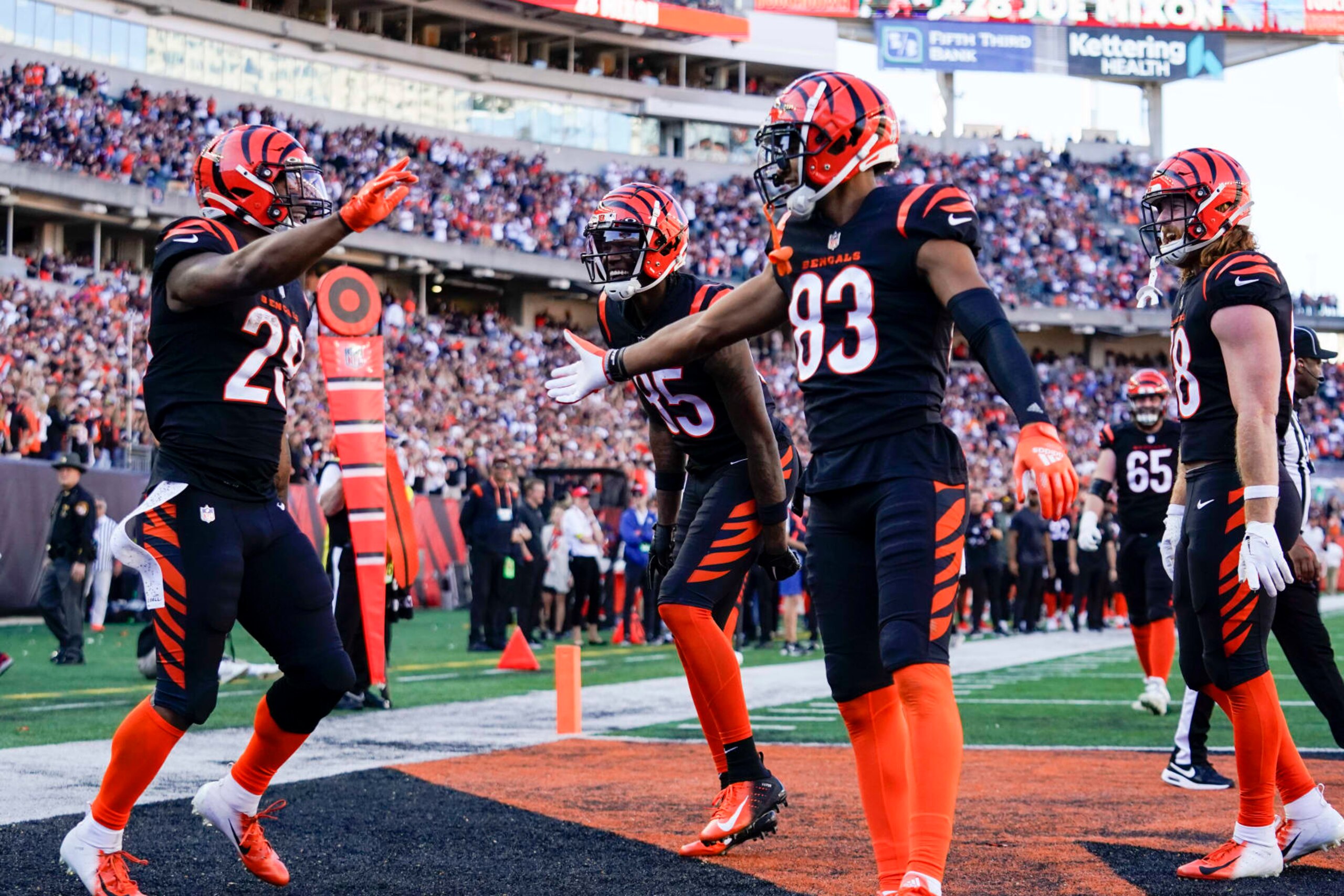 Cincinnati Bengals running back Joe Mixon (28) celebrates with teammates Tyler Boyd (83) and Tee Higgins (85) after scoring a touchdown during an NFL football game against the Carolina Panthers, Sunday, Nov. 6, 2022, in Cincinnati. (AP Photo/Jeff Dean) Cincinnati Bengals running back Joe Mixon (28) celebrates with teammates Tyler Boyd (83) and Tee Higgins (85) after scoring a touchdown during an NFL football game against the Carolina Panthers, Sunday, Nov. 6, 2022, in Cincinnati. (AP Photo/Jeff Dean)