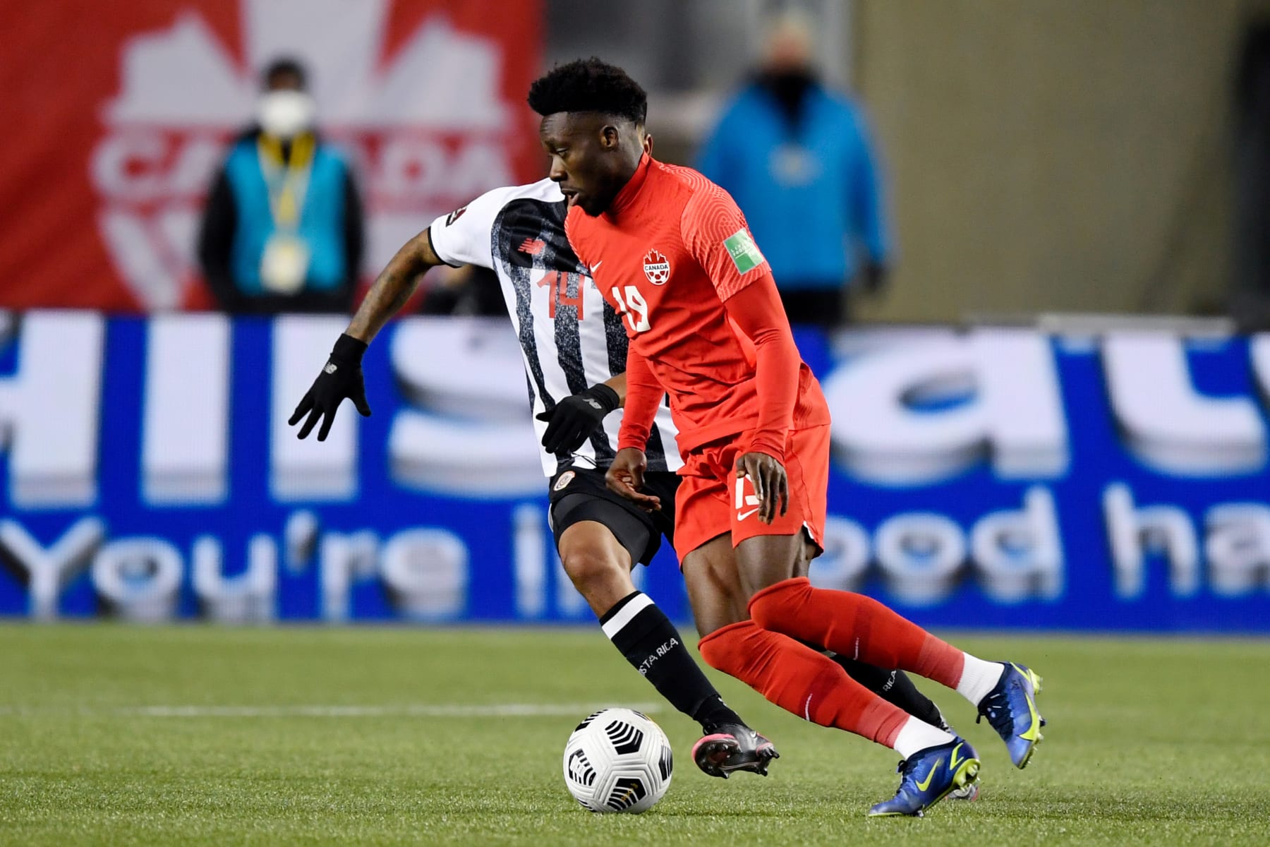 EDMONTON, CANADA - NOVEMBER 12: Orlando Galo of Costa Rica, Alphonso Davies of Canada  during the  World Cup Qualifier  match between Canada  v Costa Rica  at the Commonwealth Stadium on November 12, 2021 in Edmonton Canada (Photo by Dale Macmillan/Soccrates/Getty Images)