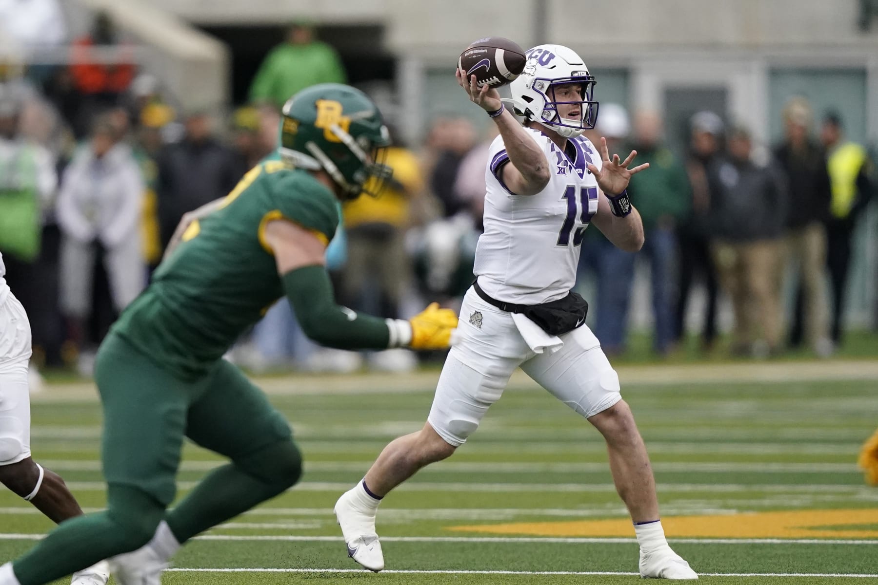TCU quarterback Max Duggan (15) passes during the first half of an NCAA college football game against Baylor in Waco, Texas, Saturday, Nov. 19, 2022. (AP Photo/LM Otero)