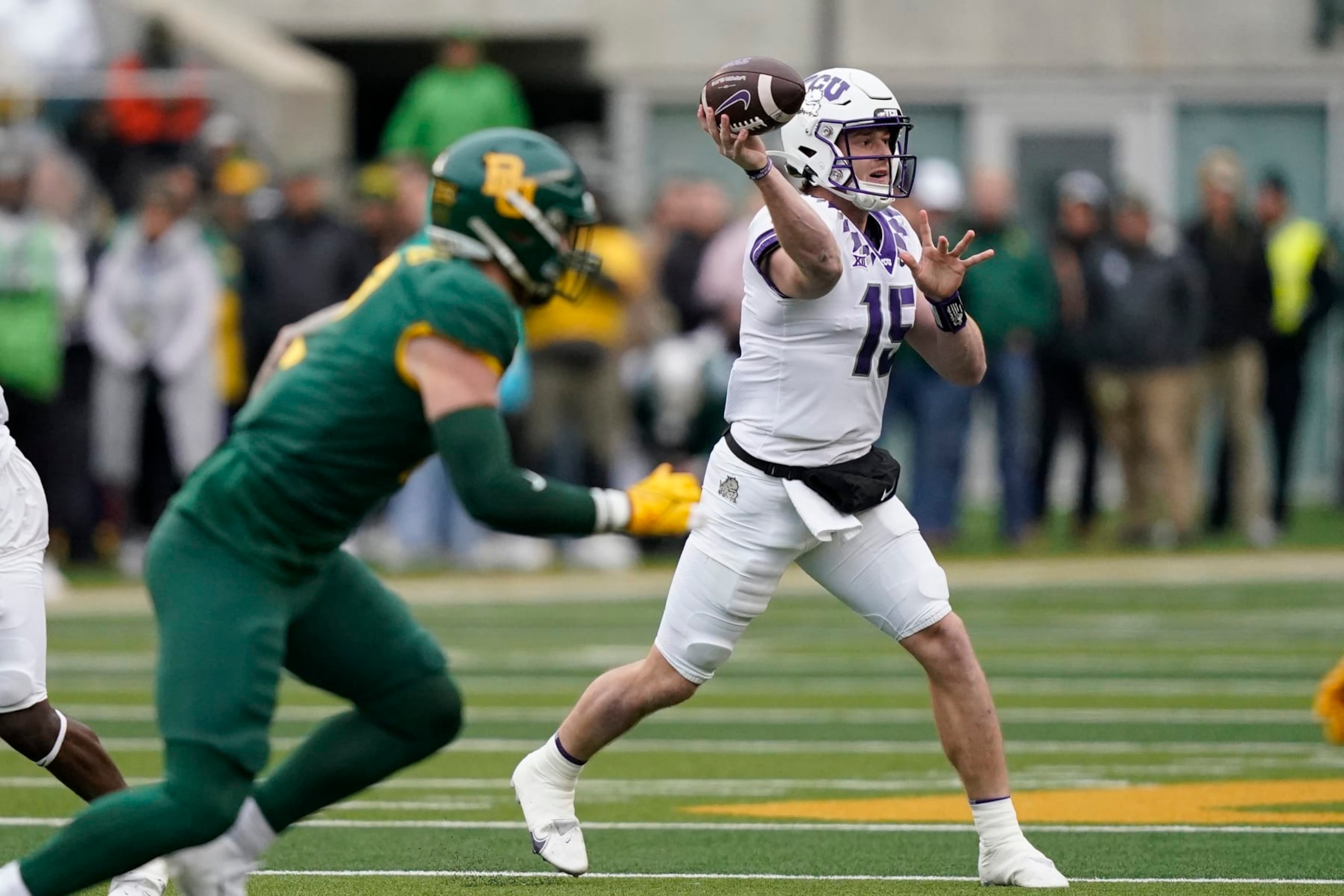 TCU quarterback Max Duggan (15) passes during the first half of an NCAA college football game against Baylor in Waco, Texas, Saturday, Nov. 19, 2022. (AP Photo/LM Otero) TCU quarterback Max Duggan (15) passes during the first half of an NCAA college football game against Baylor in Waco, Texas, Saturday, Nov. 19, 2022. (AP Photo/LM Otero)