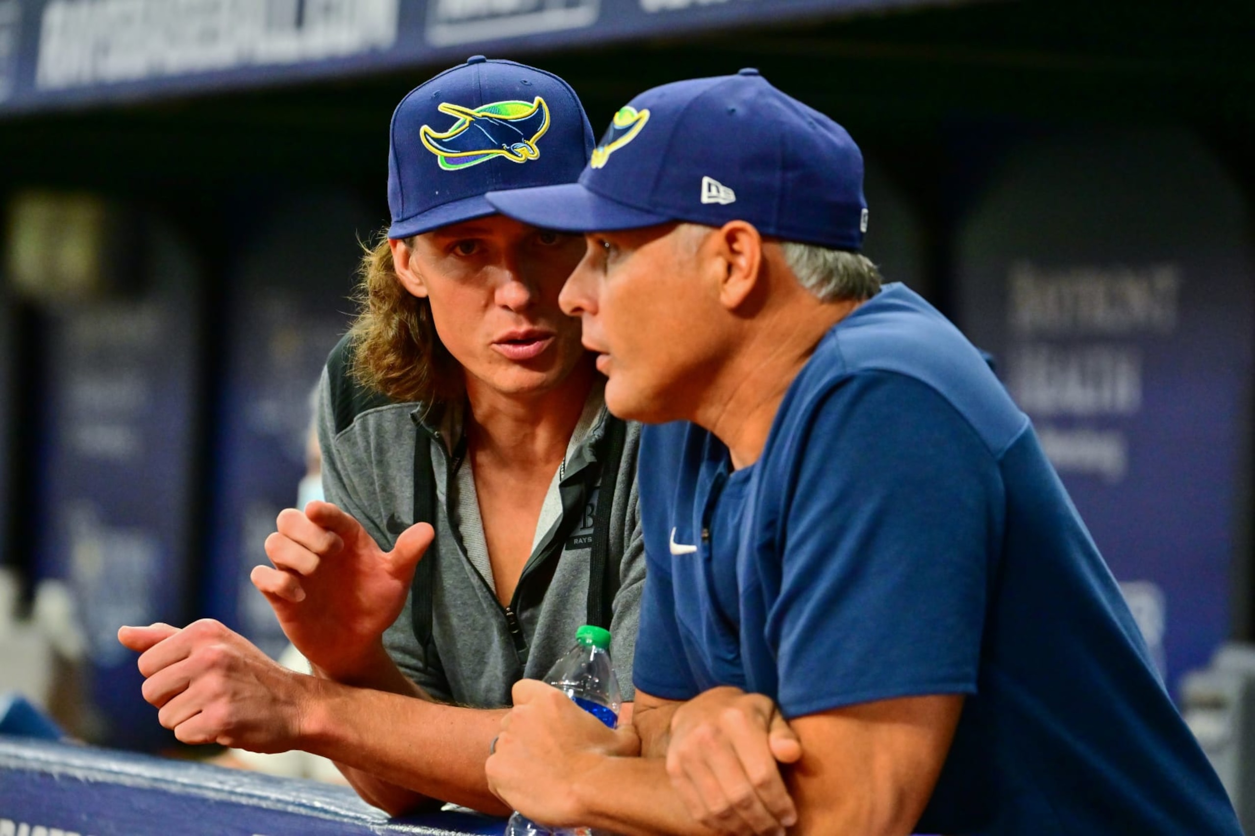 ST PETERSBURG, FLORIDA - SEPTEMBER 24: Tyler Glasnow #20 and manager Kevin Cash #16 of the Tampa Bay Rays converse during a game against the Toronto Blue Jays at Tropicana Field on September 24, 2022 in St Petersburg, Florida. (Photo by Julio Aguilar/Getty Images)