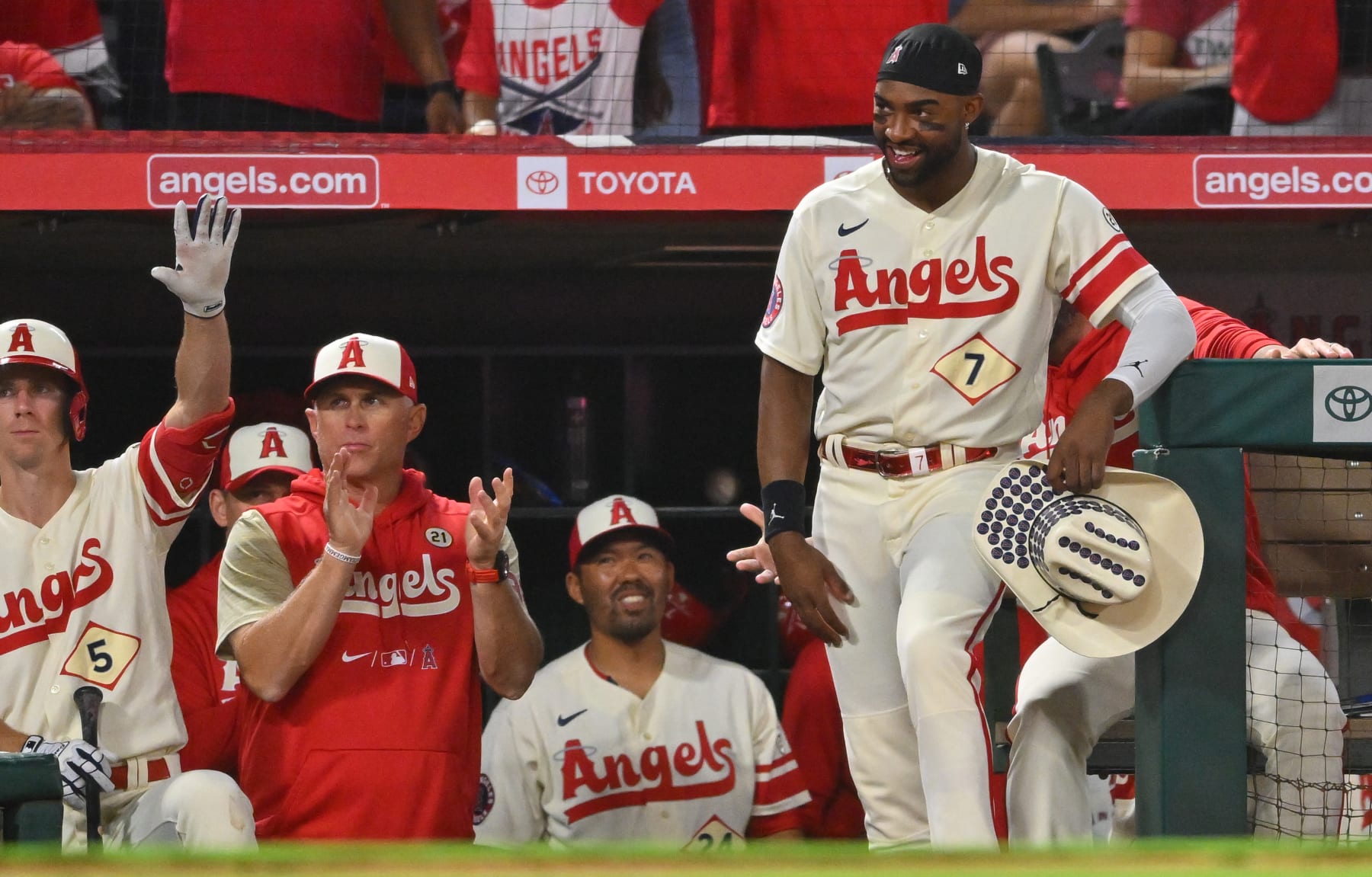 ANAHEIM, CA - SEPTEMBER 16: Matt Duffy #5 , interim manager Phil Nevin #88, Kurt Suzuki #24 and Jo Adell #7 of the Los Angeles Angels wait to greet Mike Trout #27 after a solo home run in the game against the Seattle Mariners at Angel Stadium of Anaheim on September 16, 2022 in Anaheim, California. (Photo by Jayne Kamin-Oncea/Getty Images)