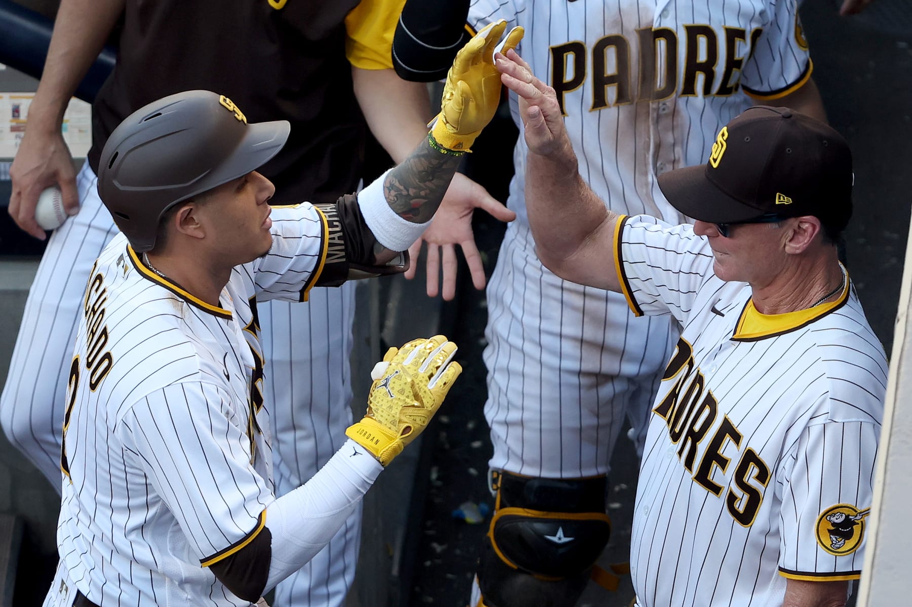 SAN DIEGO, CALIFORNIA - OCTOBER 19: Manny Machado #13 of the San Diego Padres celebrates with manager Bob Melvin after hitting a solo home run during the seventh inning against the Philadelphia Phillies in game two of the National League Championship Series at PETCO Park on October 19, 2022 in San Diego, California. (Photo by Sean M. Haffey/Getty Images)