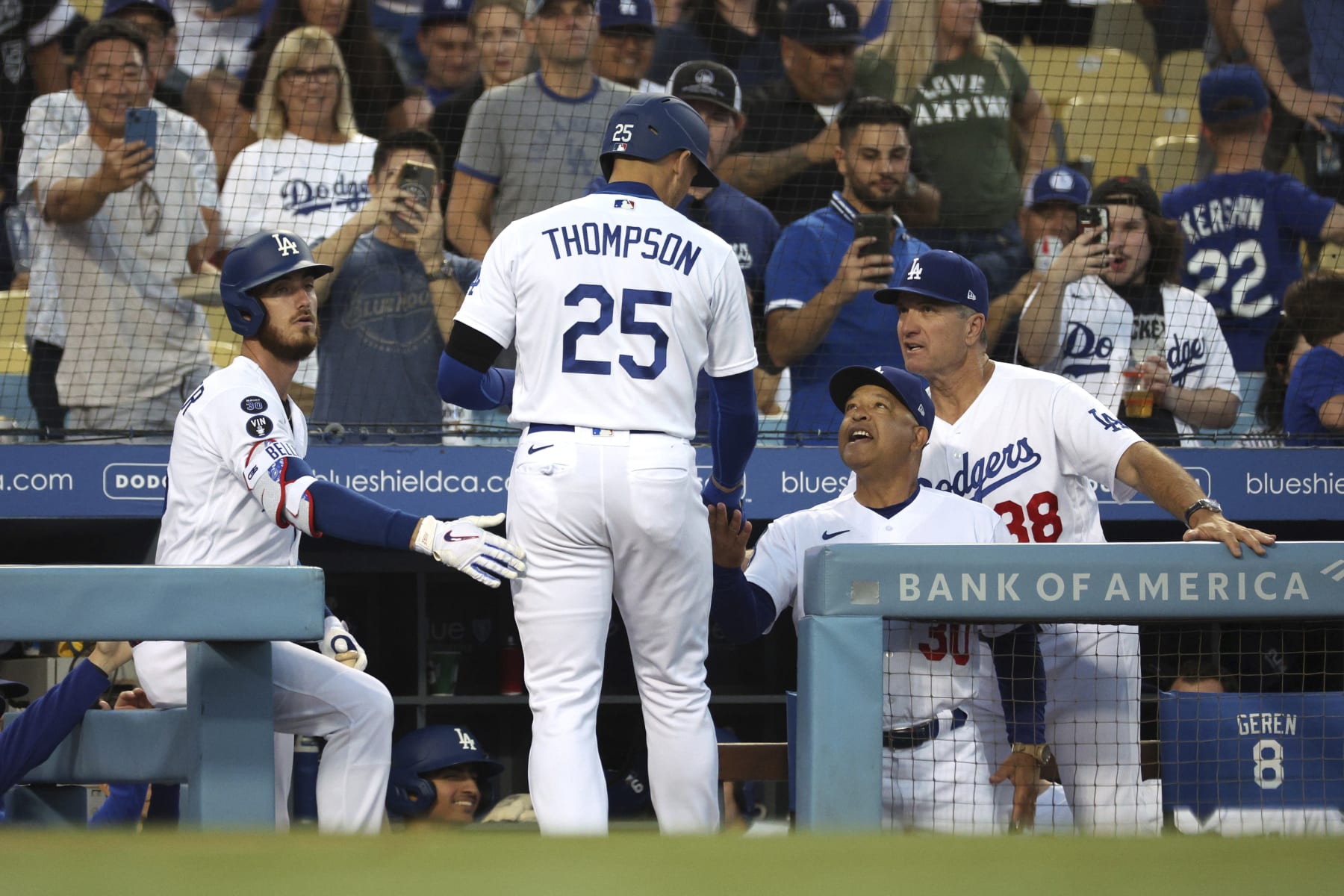 From left, Los Angeles Dodgers Cody Bellinger, Trayce Thompson, manager Dave Roberts and bench coach Bob Geren celebrate after Thompson hits a home run during the second inning of a baseball game against the St. Louis Cardinals Saturday, Sept. 24, 2022, in Los Angeles. Dodgers won 6-2. (AP Photo/Raul Romero Jr.)