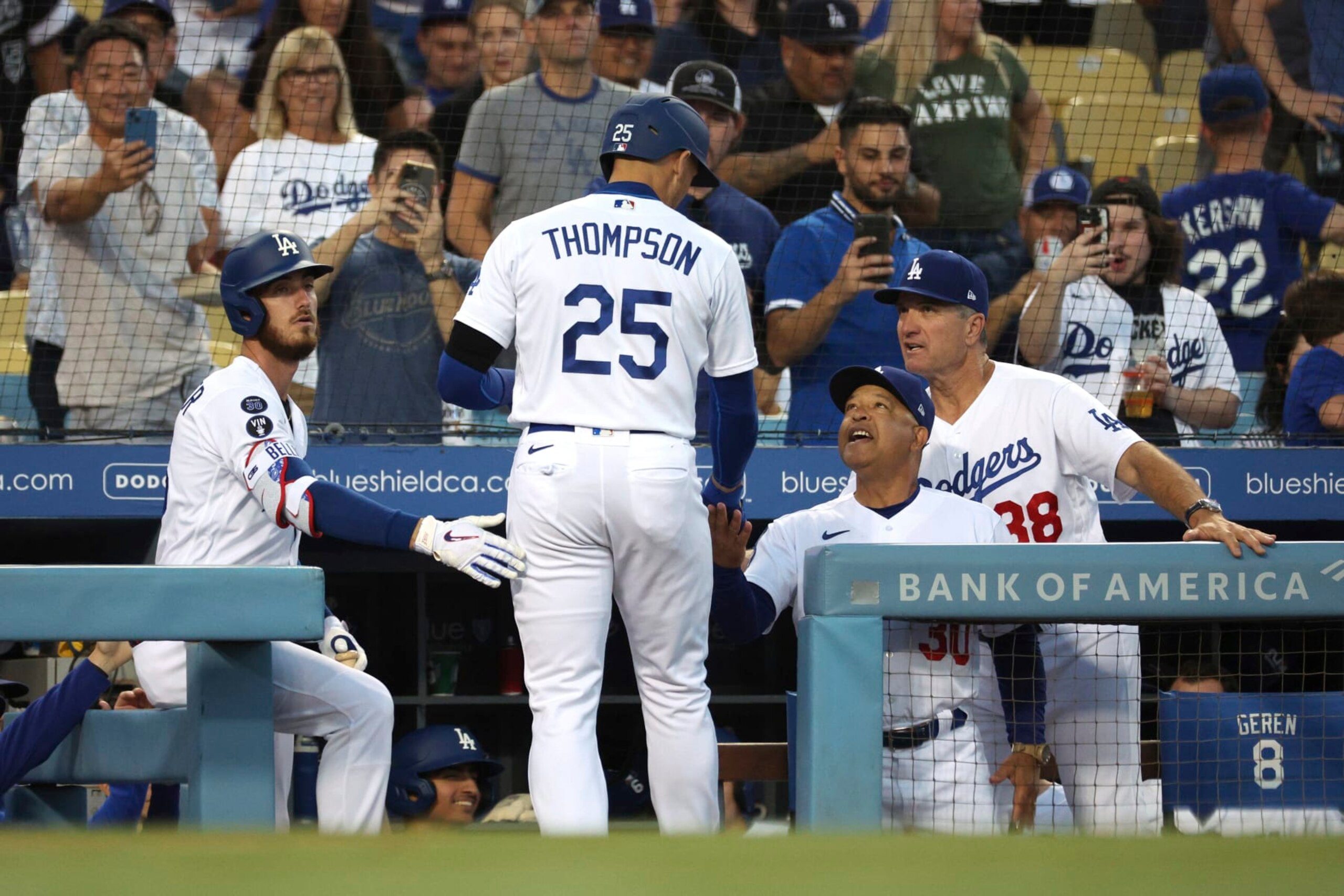 From left, Los Angeles Dodgers Cody Bellinger, Trayce Thompson, manager Dave Roberts and bench coach Bob Geren celebrate after Thompson hits a home run during the second inning of a baseball game against the St. Louis Cardinals Saturday, Sept. 24, 2022, in Los Angeles. Dodgers won 6-2. (AP Photo/Raul Romero Jr.)