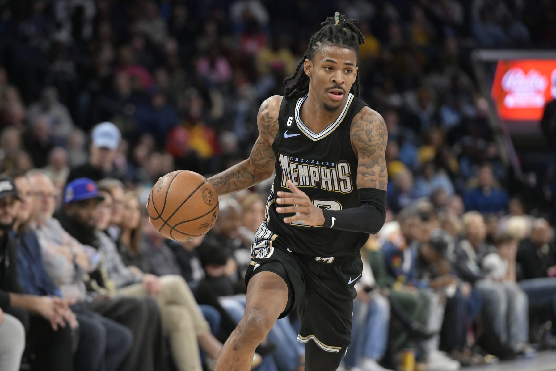 Memphis Grizzlies guard Ja Morant (12) handles the ball in the first half of an NBA basketball game against the Oklahoma City Thunder Friday, Nov. 18, 2022, in Memphis, Tenn. (AP Photo/Brandon Dill)