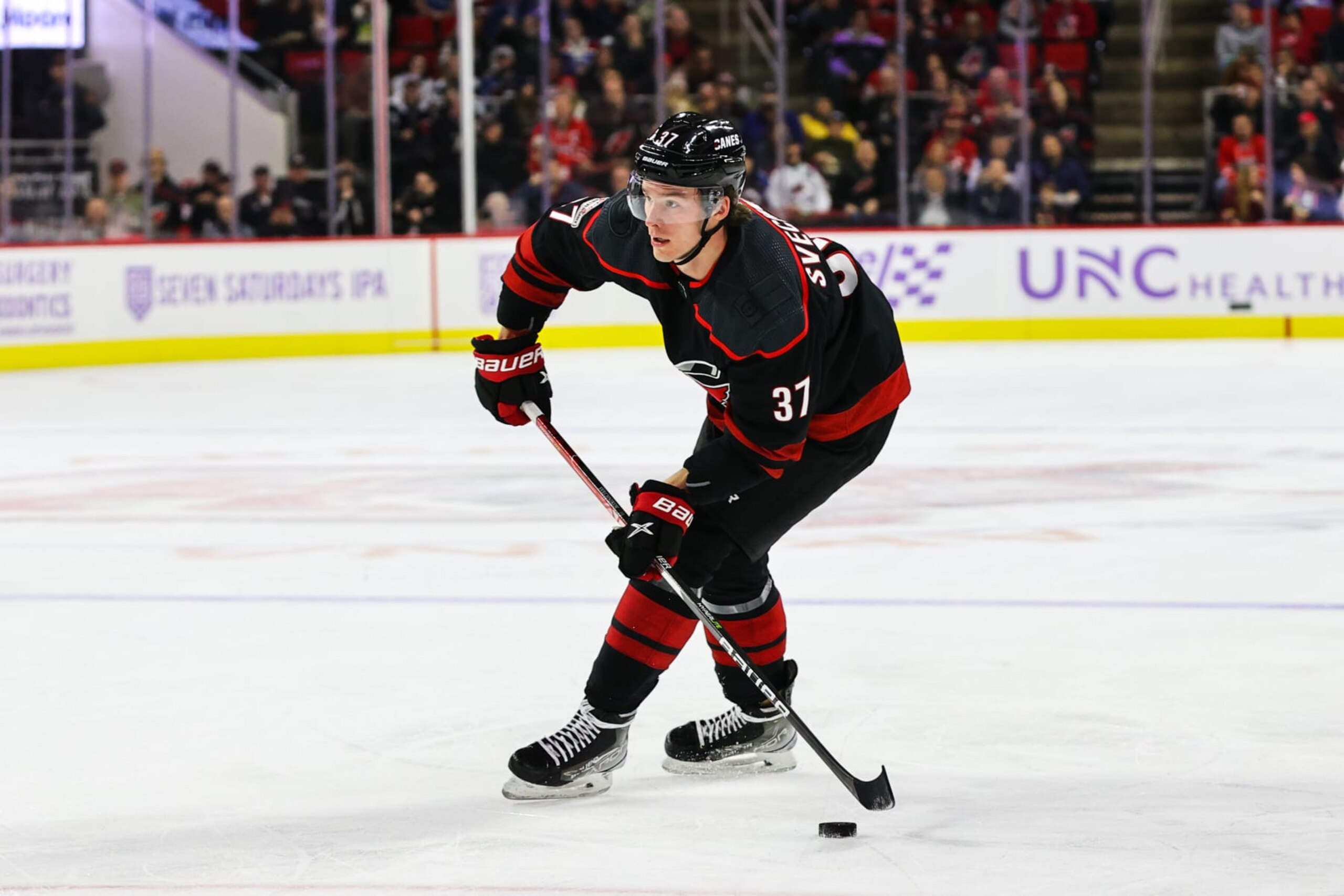 RALEIGH, NC - NOVEMBER 17: Andrei Svechnikov #37 of the Carolina Hurricanes looks to pass the puck during the first period of an NHL game against the Colorado Avalanche at PNC Arena on November 17, 2022 in Raleigh, North Carolina. (Photo by Jaylynn Nash/NHLI via Getty Images)