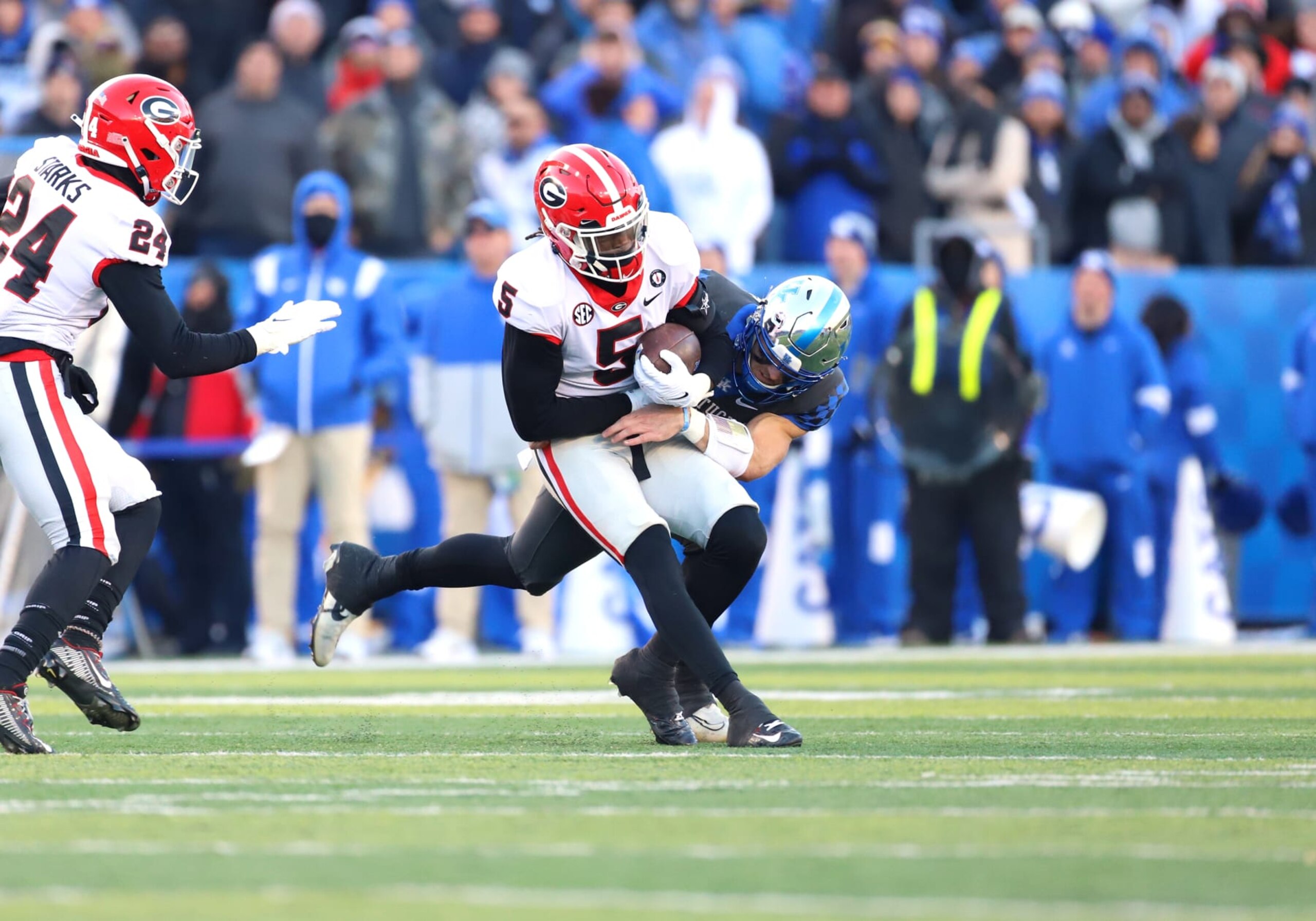 LEXINGTON, KY - NOVEMBER 19: Georgia Bulldogs defensive back Kelee Ringo (5) is tackled by Kentucky Wildcats quarterback Will Levis (7) after intercepting a pass in a game between the Georgia Bulldogs and the Kentucky Wildcats on November 19, 2022, at Kroger Field in Lexington, KY. (Photo by Jeff Moreland/Icon Sportswire via Getty Images) LEXINGTON, KY - NOVEMBER 19: Georgia Bulldogs defensive back Kelee Ringo (5) is tackled by Kentucky Wildcats quarterback Will Levis (7) after intercepting a pass in a game between the Georgia Bulldogs and the Kentucky Wildcats on November 19, 2022, at Kroger Field in Lexington, KY. (Photo by Jeff Moreland/Icon Sportswire via Getty Images)