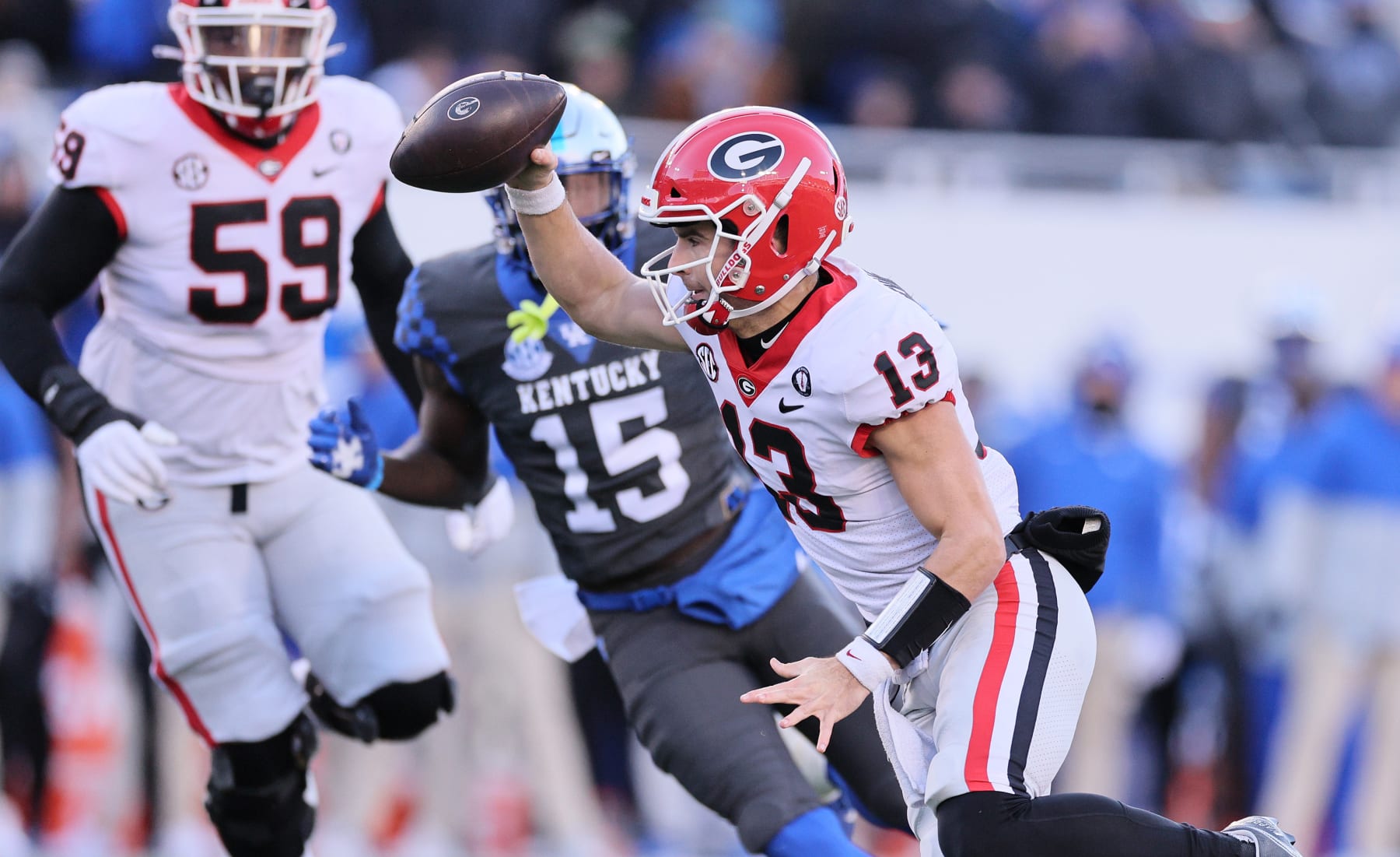 LEXINGTON, KENTUCKY - NOVEMBER 19: Stetson Bennett #13 of the Georgia Bulldogs runs with the ball against the Kentucky Wildcats at Kroger Field on November 19, 2022 in Lexington, Kentucky. (Photo by Andy Lyons/Getty Images)