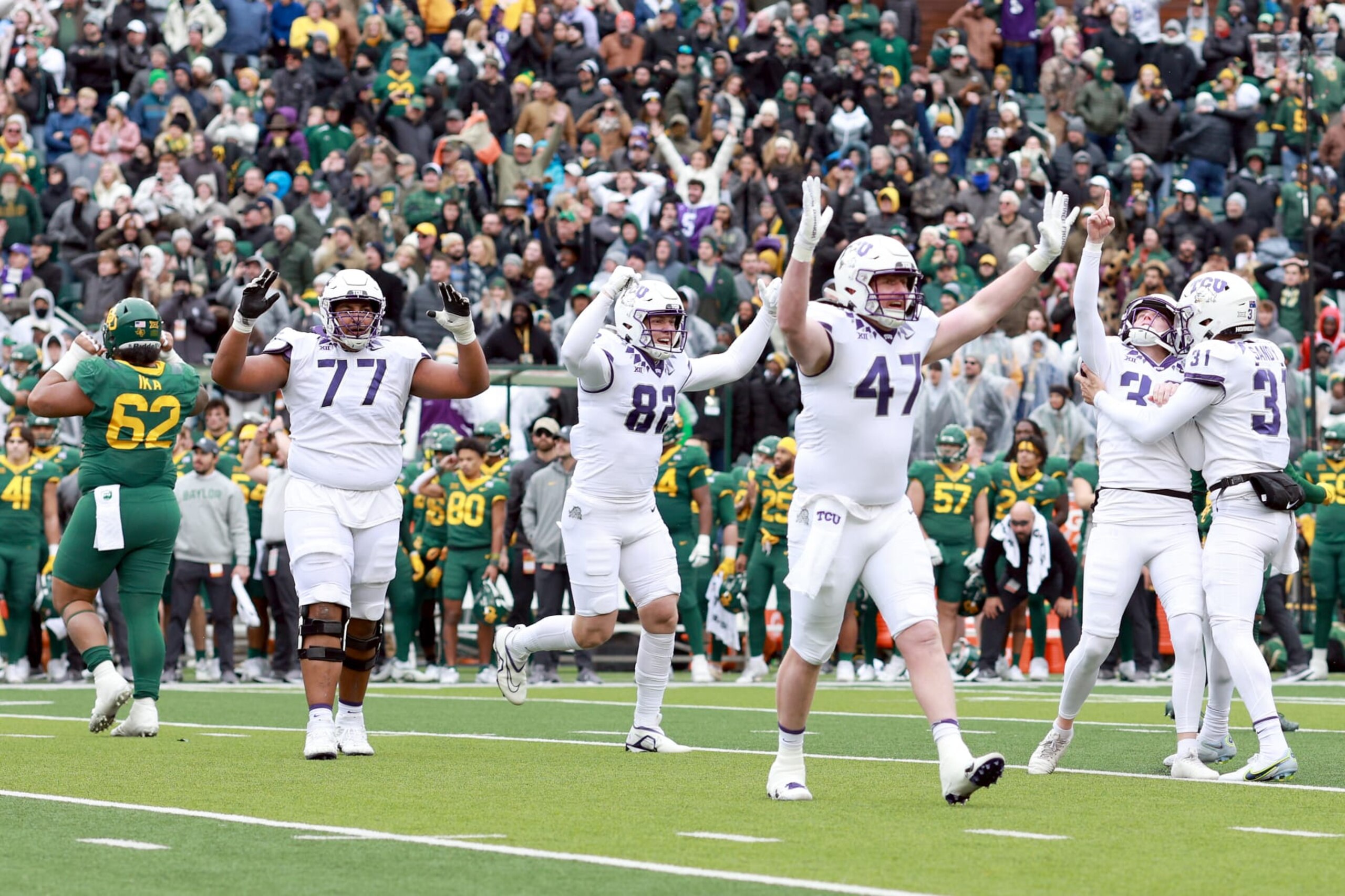 WACO, TEXAS - NOVEMBER 19: Place kicker Griffin Kell #39 of the TCU Horned Frogs celebrates with punter Jordy Sandy #31, offensive tackle Brandon Coleman #77, tight end Alex Honig #82 and tight end Carter Ware #47 of the TCU Horned Frogs after kicking the game-winning field goal in the final seconds against Baylor Bears at McLane Stadium on November 19, 2022 in Waco, Texas. (Photo by Tom Pennington/Getty Images) WACO, TEXAS - NOVEMBER 19: Place kicker Griffin Kell #39 of the TCU Horned Frogs celebrates with punter Jordy Sandy #31, offensive tackle Brandon Coleman #77, tight end Alex Honig #82 and tight end Carter Ware #47 of the TCU Horned Frogs after kicking the game-winning field goal in the final seconds against Baylor Bears at McLane Stadium on November 19, 2022 in Waco, Texas. (Photo by Tom Pennington/Getty Images)