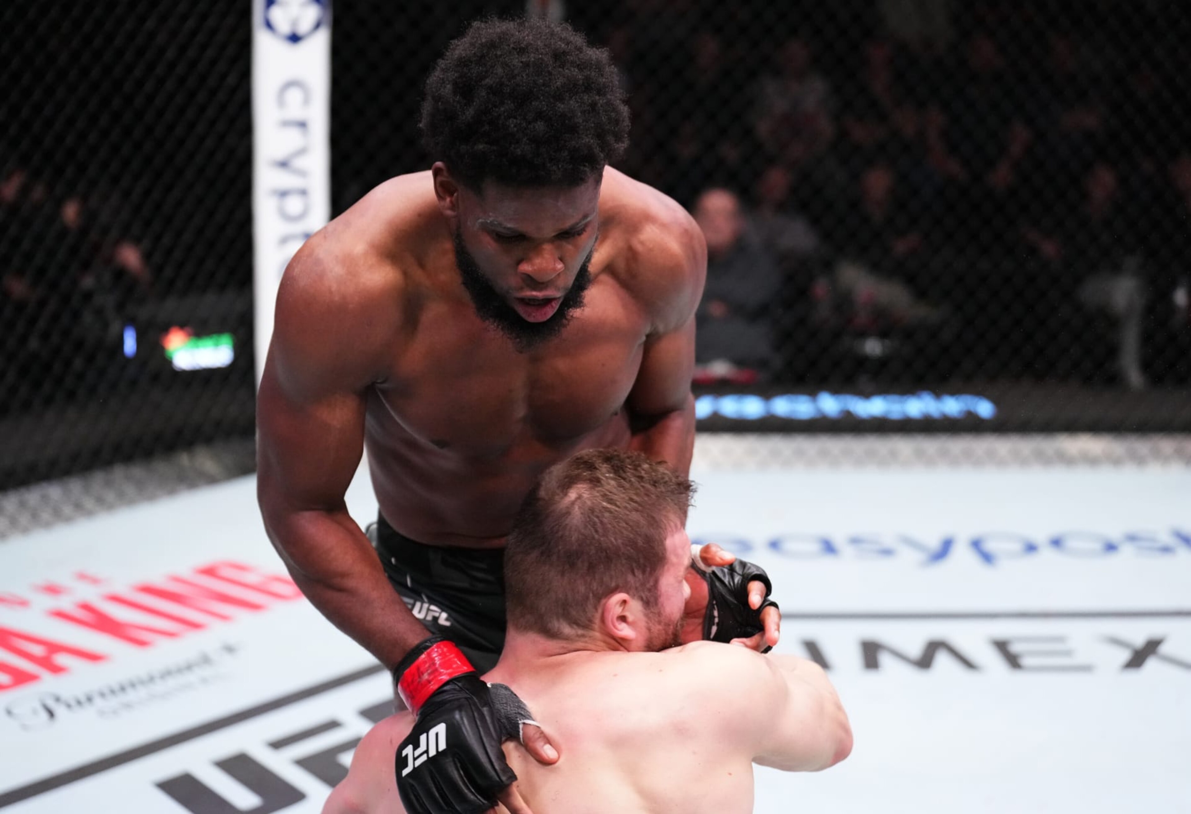 LAS VEGAS, NEVADA - NOVEMBER 19: (R-L) Kennedy Nzechukwu of Nigeria drops Ion Cutelaba of Moldova with a flying knee in a light heavyweight fight during the UFC Fight Night event at UFC APEX on November 19, 2022 in Las Vegas, Nevada. (Photo by Chris Unger/Zuffa LLC) LAS VEGAS, NEVADA - NOVEMBER 19: (R-L) Kennedy Nzechukwu of Nigeria drops Ion Cutelaba of Moldova with a flying knee in a light heavyweight fight during the UFC Fight Night event at UFC APEX on November 19, 2022 in Las Vegas, Nevada. (Photo by Chris Unger/Zuffa LLC)