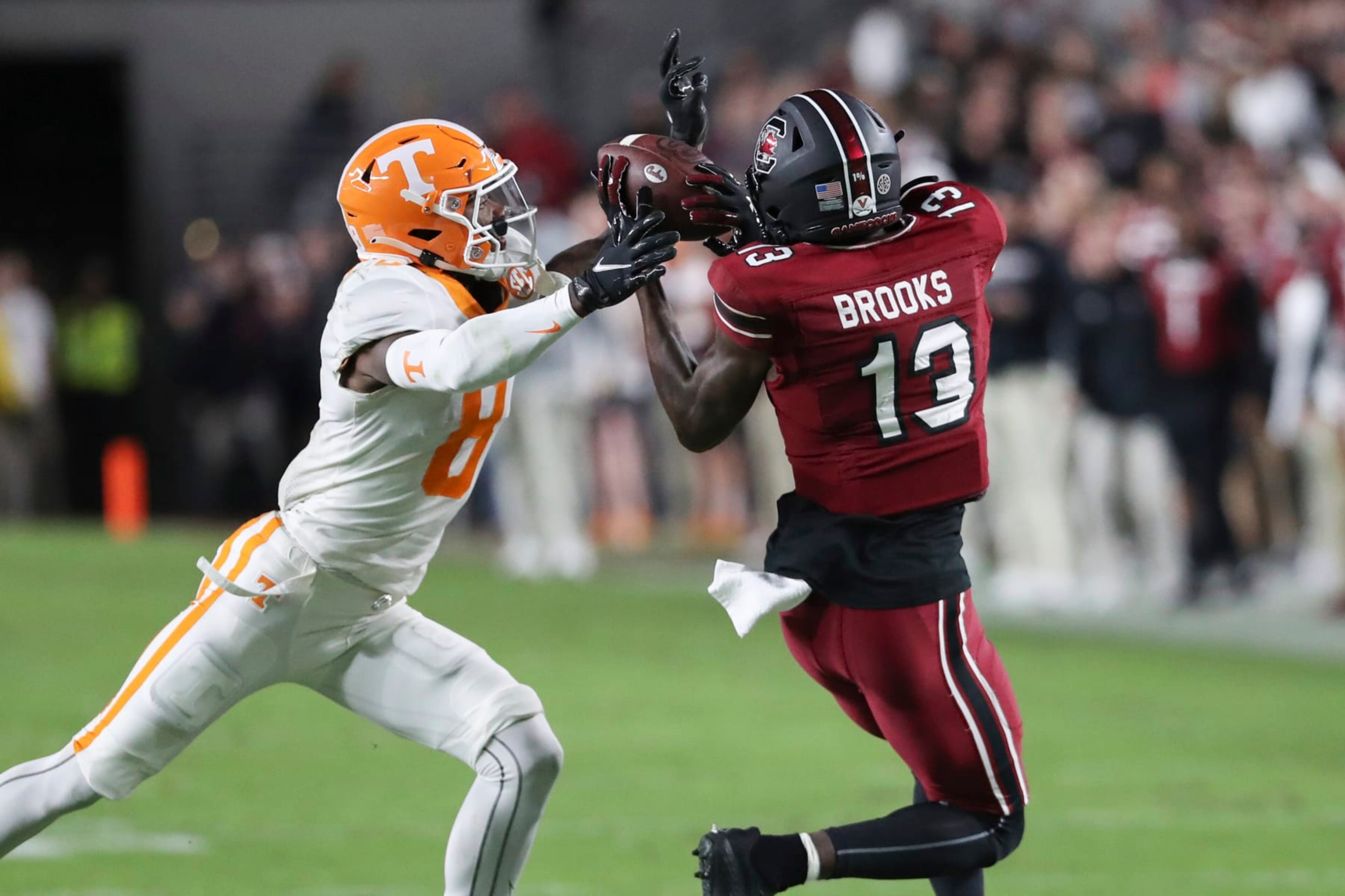South Carolina wide receiver Jalen Brooks (13) makes a catch next to Tennessee defensive back Brandon Turnage (8) during the first half of an NCAA college football game Saturday, Nov. 19, 2022, in Columbia, S.C. (AP Photo/Artie Walker Jr.) South Carolina wide receiver Jalen Brooks (13) makes a catch next to Tennessee defensive back Brandon Turnage (8) during the first half of an NCAA college football game Saturday, Nov. 19, 2022, in Columbia, S.C. (AP Photo/Artie Walker Jr.)