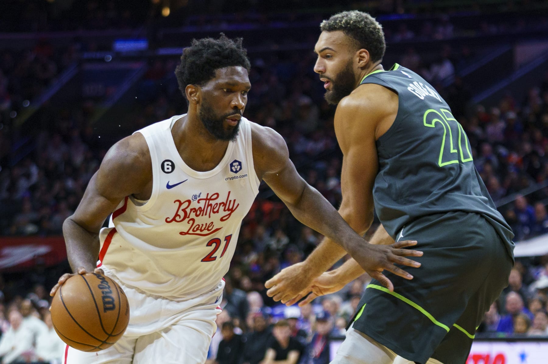 Philadelphia 76ers' Joel Embiid, left, drives to the basket against Minnesota Timberwolves' Rudy Gobert, right, during the second half of an NBA basketball game, Saturday, Nov. 19, 2022, in Philadelphia. (AP Photo/Chris Szagola)
