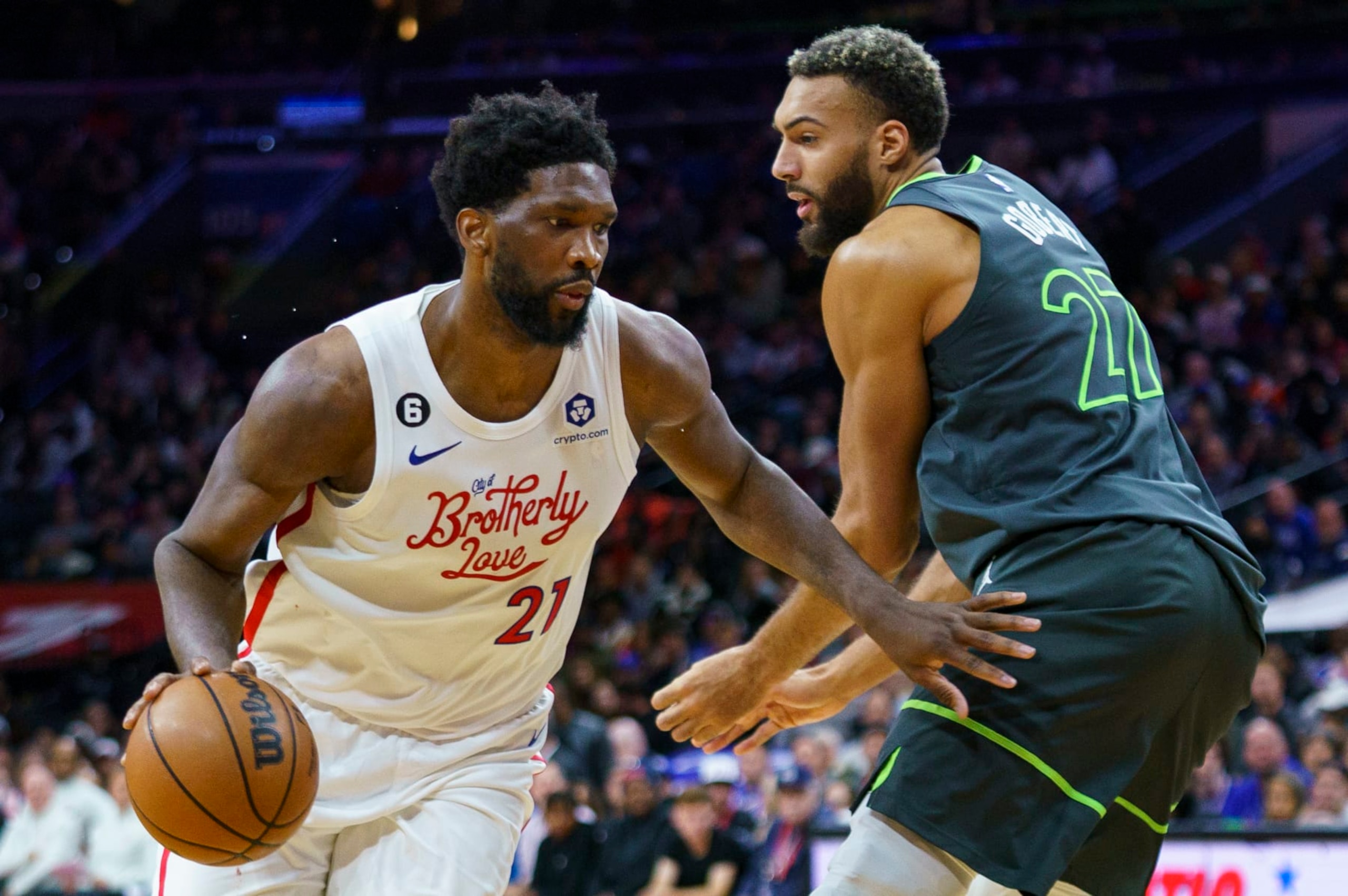 Philadelphia 76ers' Joel Embiid, left, drives to the basket against Minnesota Timberwolves' Rudy Gobert, right, during the second half of an NBA basketball game, Saturday, Nov. 19, 2022, in Philadelphia. (AP Photo/Chris Szagola)