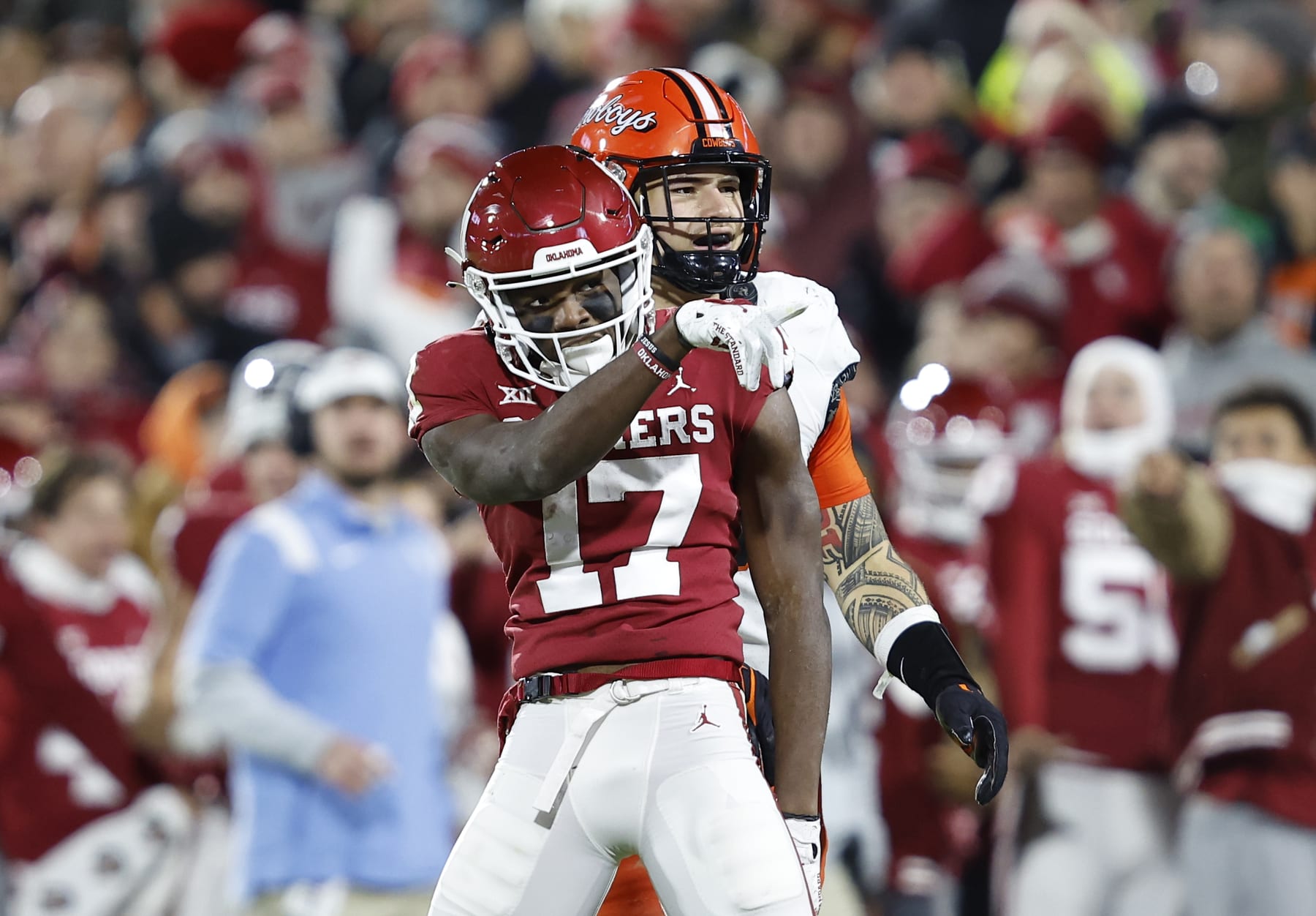 Oklahoma wide receiver Marvin Mims Jr. (17) gestures after running for a first down against Oklahoma State during the first half of an NCAA college football game Saturday, Nov. 19, 2022, in Norman, Okla. (AP Photo/Alonzo Adams)
