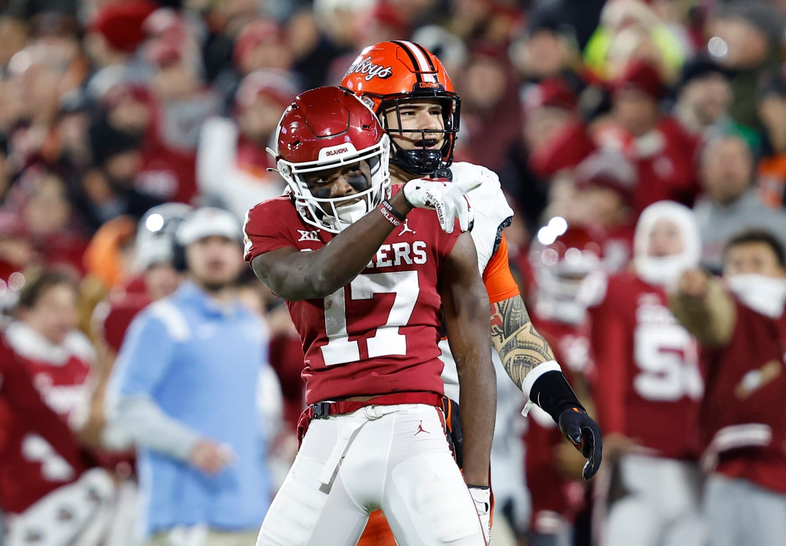 Oklahoma wide receiver Marvin Mims Jr. (17) gestures after running for a first down against Oklahoma State during the first half of an NCAA college football game Saturday, Nov. 19, 2022, in Norman, Okla. (AP Photo/Alonzo Adams) Oklahoma wide receiver Marvin Mims Jr. (17) gestures after running for a first down against Oklahoma State during the first half of an NCAA college football game Saturday, Nov. 19, 2022, in Norman, Okla. (AP Photo/Alonzo Adams)