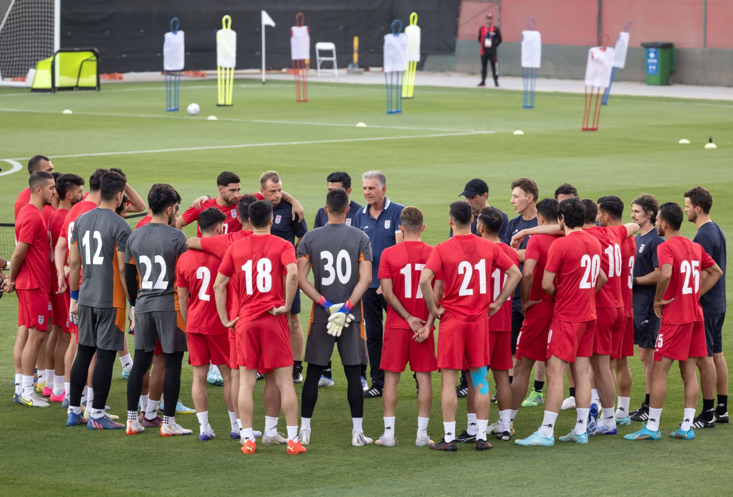 Iran's coach Carlos Queiroz (C) talks to his team during a training session in Doha on November 17, 2022, ahead of the Qatar 2022 World Cup football tournament. (Photo by FADEL SENNA / AFP) (Photo by FADEL SENNA/AFP via Getty Images) Iran's coach Carlos Queiroz (C) talks to his team during a training session in Doha on November 17, 2022, ahead of the Qatar 2022 World Cup football tournament. (Photo by FADEL SENNA / AFP) (Photo by FADEL SENNA/AFP via Getty Images)
