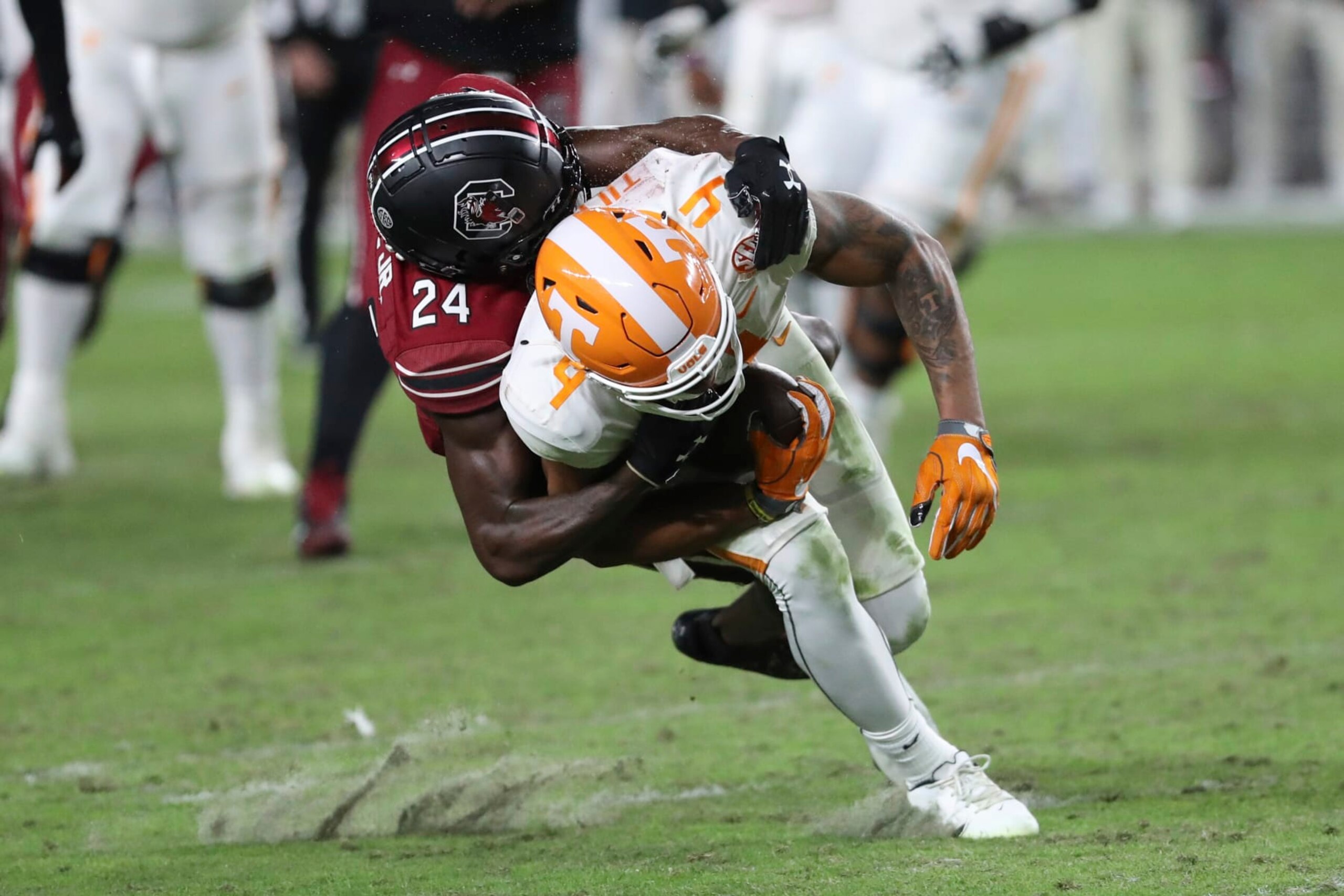 South Carolina defensive back Marcellas Dial Jr. (24) tackles Tennessee wide receiver Cedric Tillman (4) after a catch during the second half of an NCAA college football game Saturday, Nov. 19, 2022, in Columbia, S.C. (AP Photo/Artie Walker Jr.)
