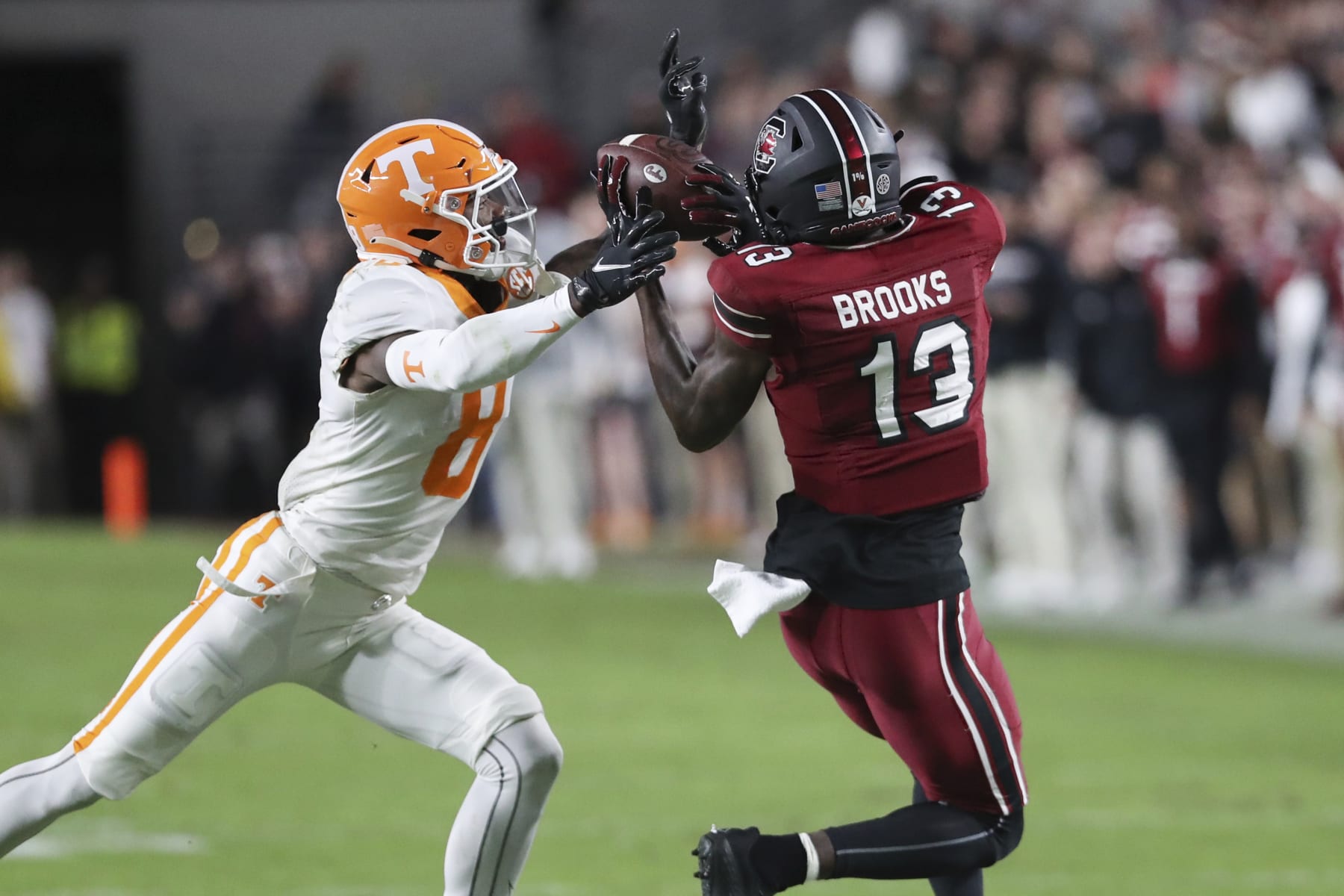 South Carolina wide receiver Jalen Brooks (13) makes a catch next to Tennessee defensive back Brandon Turnage (8) during the first half of an NCAA college football game Saturday, Nov. 19, 2022, in Columbia, S.C. (AP Photo/Artie Walker Jr.)