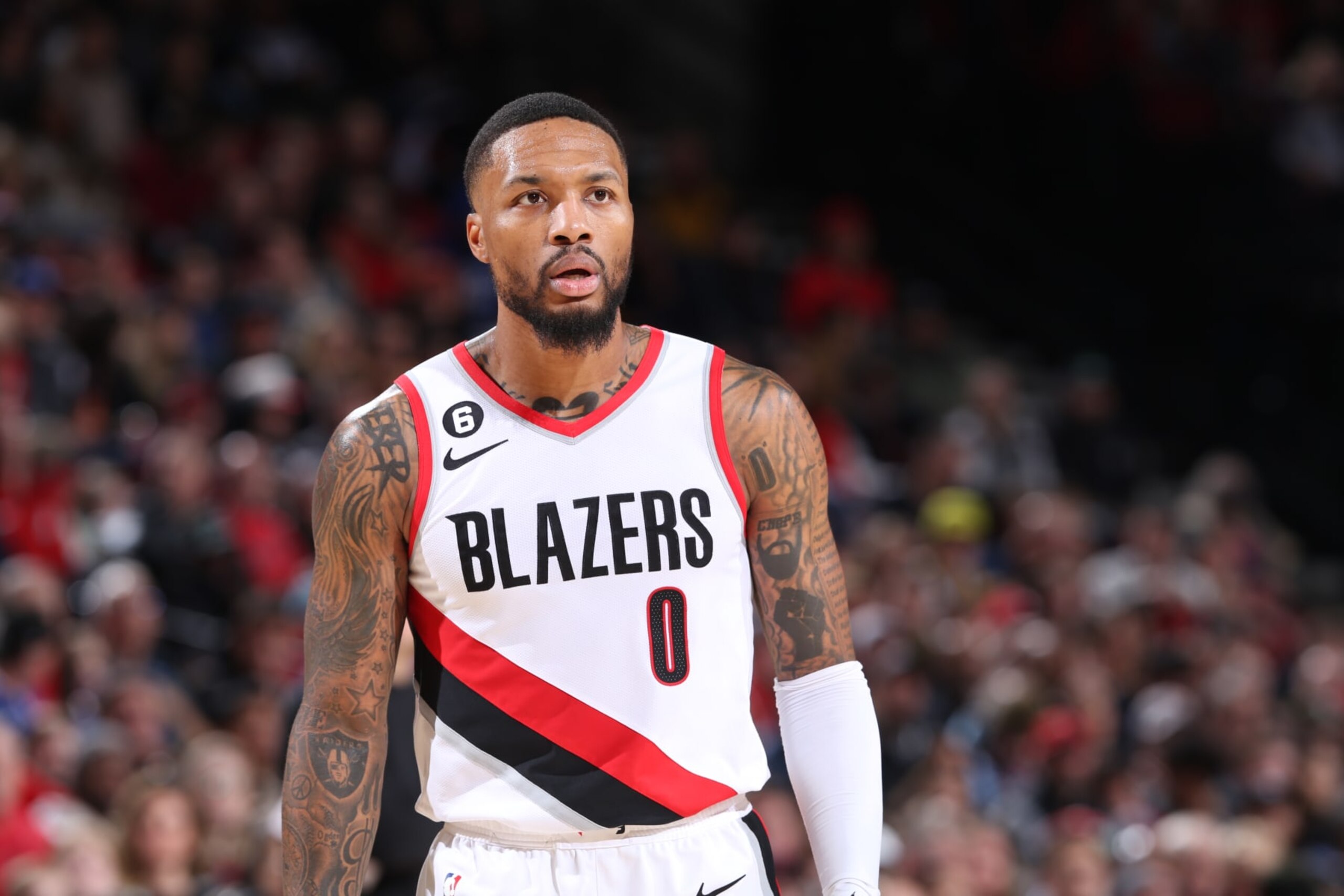 PORTLAND, OR - NOVEMBER 19: Damian Lillard #0 of the Portland Trail Blazers looks on during the game against the Utah Jazz on November 19, 2022 at the Moda Center Arena in Portland, Oregon. NOTE TO USER: User expressly acknowledges and agrees that, by downloading and or using this photograph, user is consenting to the terms and conditions of the Getty Images License Agreement. Mandatory Copyright Notice: Copyright 2022 NBAE (Photo by Sam Forencich/NBAE via Getty Images)
