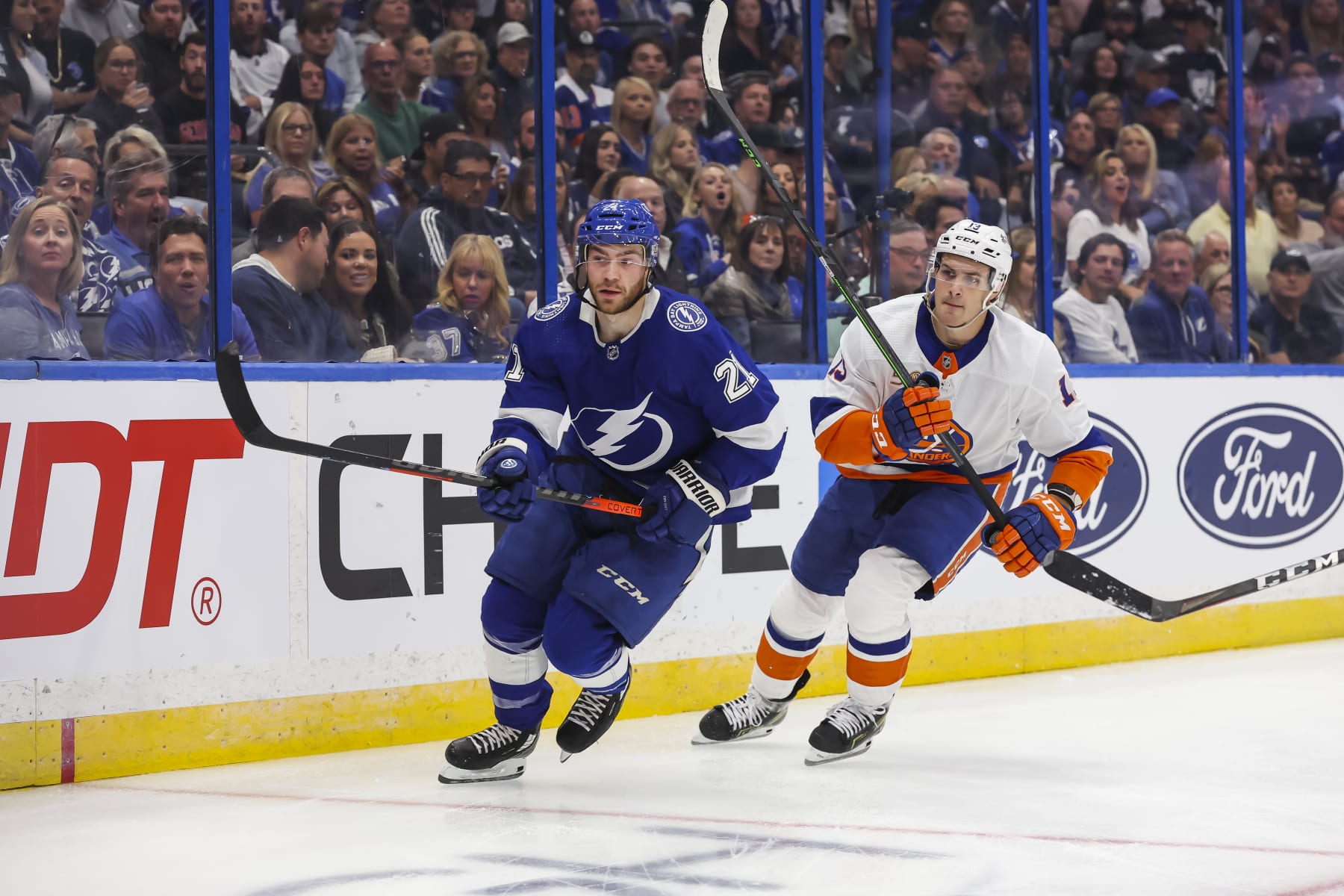 Tampa Bay Lightning forward Brayden Point (left) and New York Islanders center Mathew Barzal. 