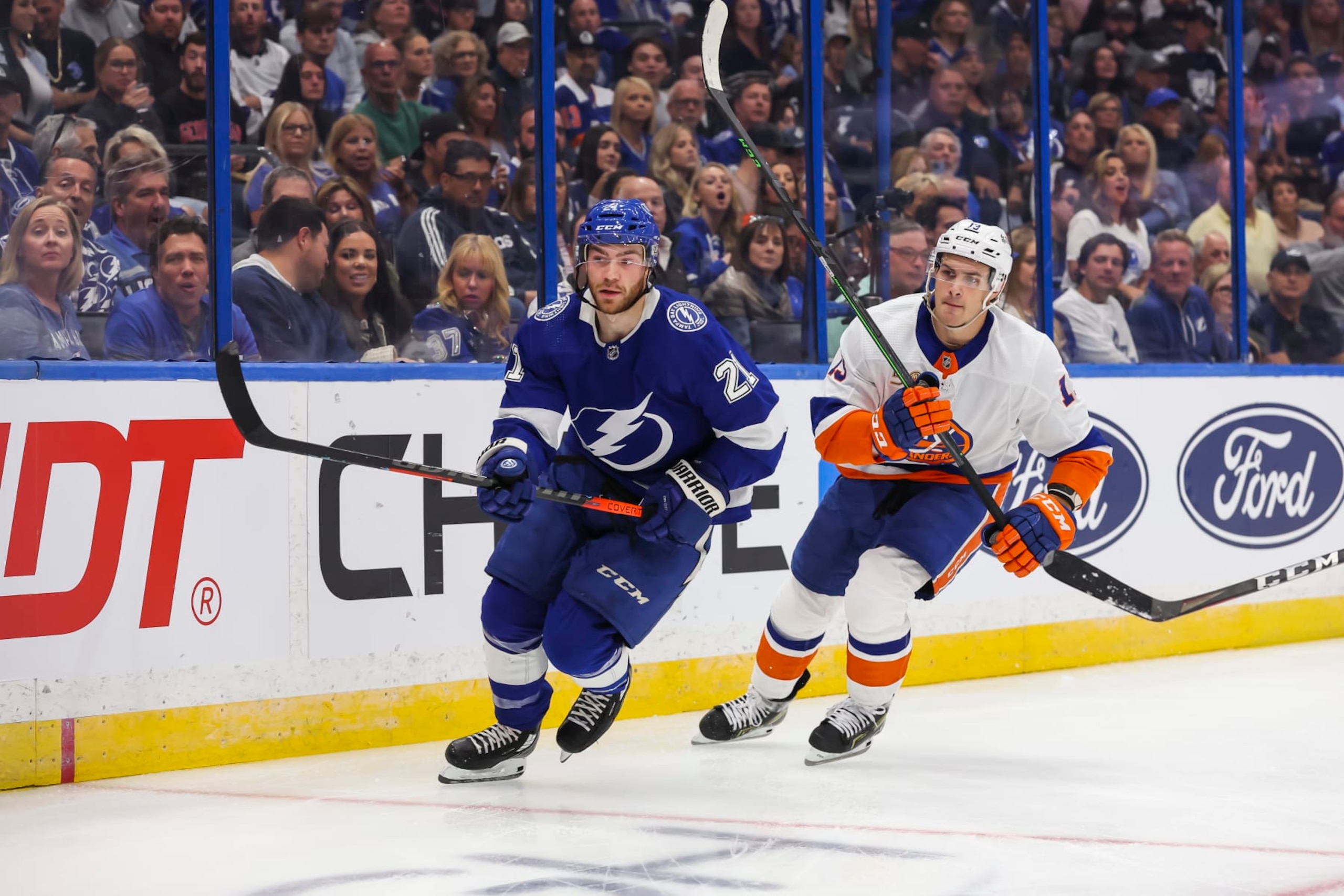 Tampa Bay Lightning forward Brayden Point (left) and New York Islanders center Mathew Barzal. 