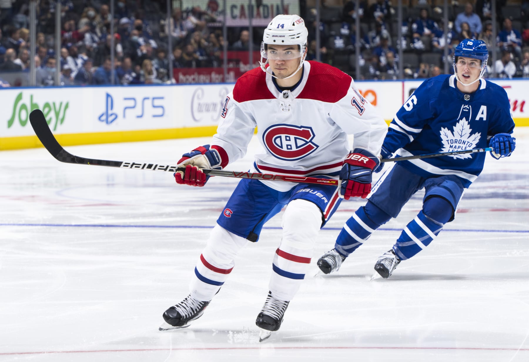 Montreal Canadiens center Nick Suzuki and Toronto Maple Leafs winger Mitch Marner. 