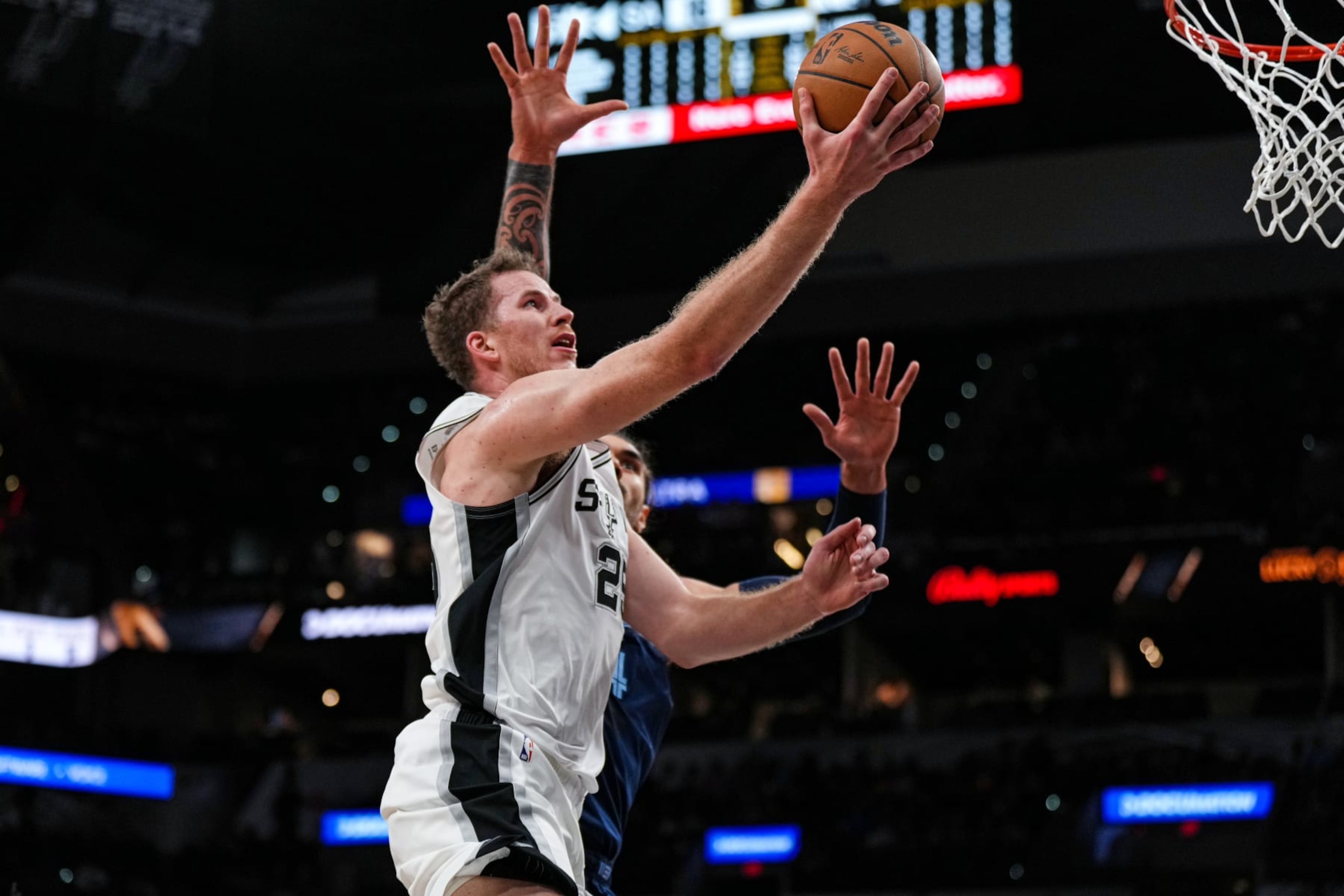 SAN ANTONIO, TX - NOVEMBER 9: Jakob Poeltl #25 of the San Antonio Spurs drives to the basket against the Memphis Grizzlies on November 9, 2022 at the AT&T Center in San Antonio, Texas. NOTE TO USER: User expressly acknowledges and agrees that, by downloading and or using this photograph, user is consenting to the terms and conditions of the Getty Images License Agreement. Mandatory Copyright Notice: Copyright 2022 NBAE (Photos by Cooper Neill/NBAE via Getty Images) SAN ANTONIO, TX - NOVEMBER 9: Jakob Poeltl #25 of the San Antonio Spurs drives to the basket against the Memphis Grizzlies on November 9, 2022 at the AT&T Center in San Antonio, Texas. NOTE TO USER: User expressly acknowledges and agrees that, by downloading and or using this photograph, user is consenting to the terms and conditions of the Getty Images License Agreement. Mandatory Copyright Notice: Copyright 2022 NBAE (Photos by Cooper Neill/NBAE via Getty Images)