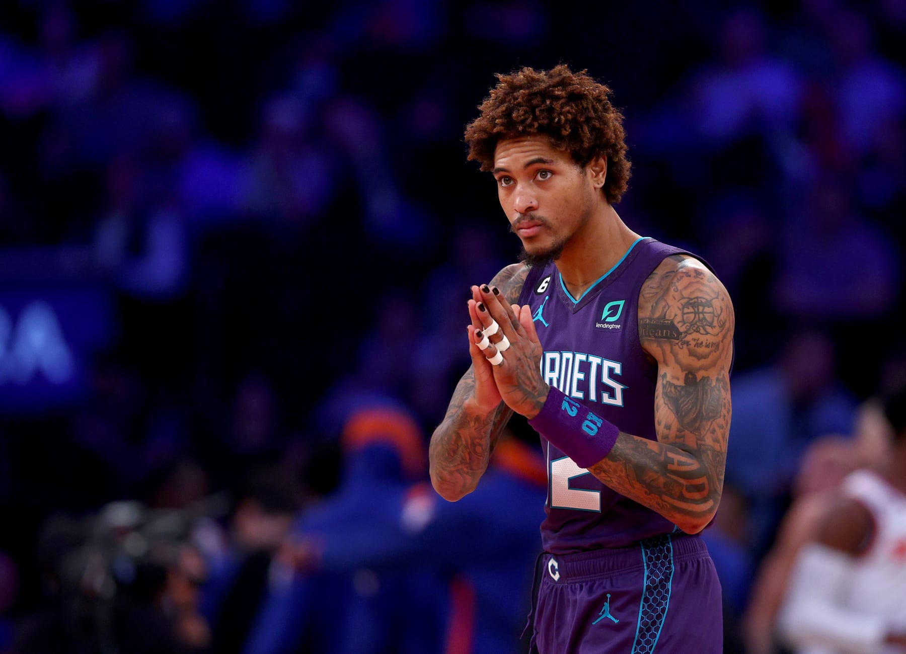 NEW YORK, NEW YORK - OCTOBER 26:  Kelly Oubre Jr. #12 of the Charlotte Hornets reacts before the opening tipoff against the New York Knicks at Madison Square Garden on October 26, 2022 in New York City. NOTE TO USER: User expressly acknowledges and agrees that, by downloading and or using this photograph, User is consenting to the terms and conditions of the Getty Images License Agreement. (Photo by Elsa/Getty Images)