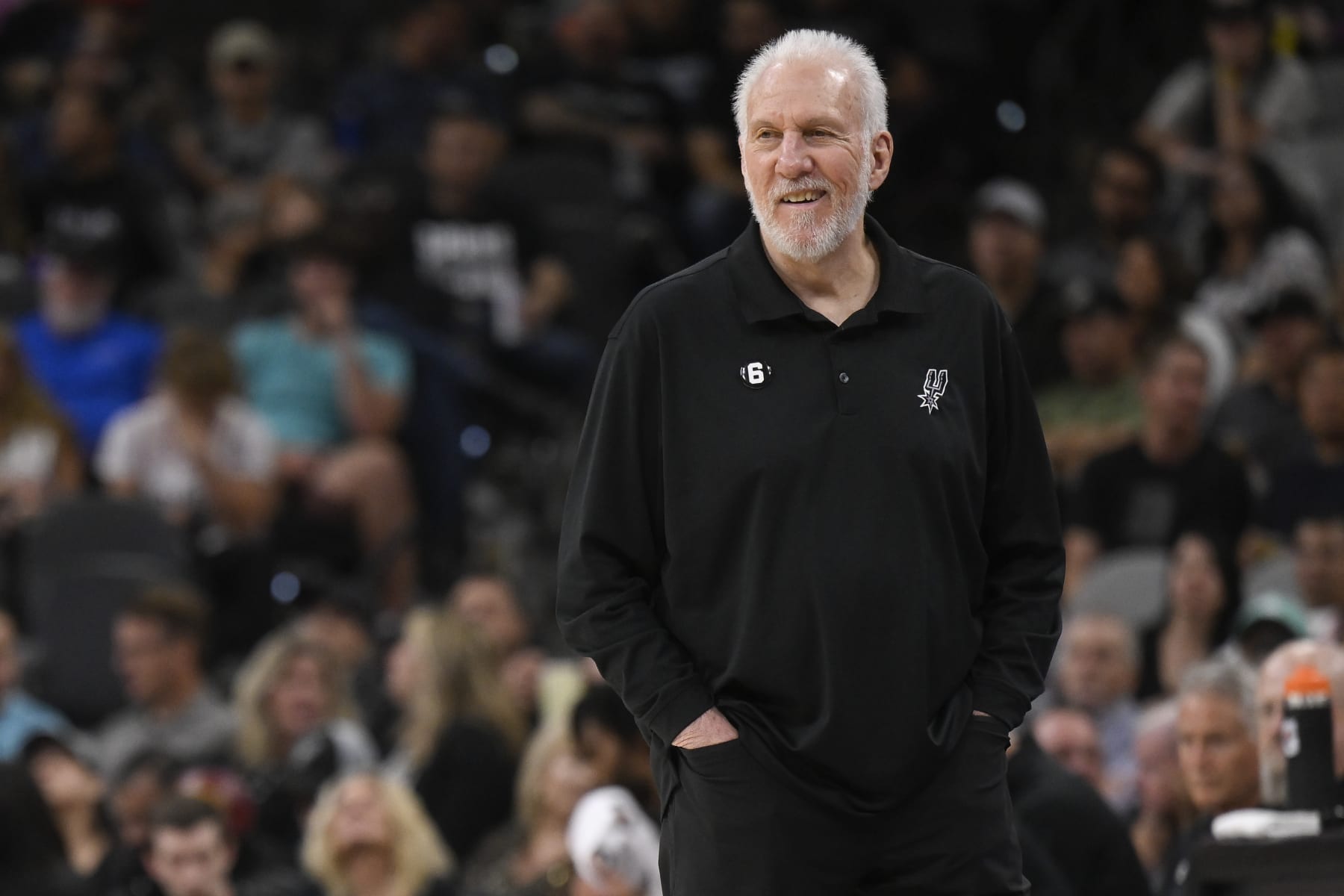 San Antonio Spurs head coach Gregg Popovich watches game action during the first half of an NBA basketball game against the Denver Nuggets, Monday, Nov. 7, 2022, in San Antonio. (AP Photo/Darren Abate)