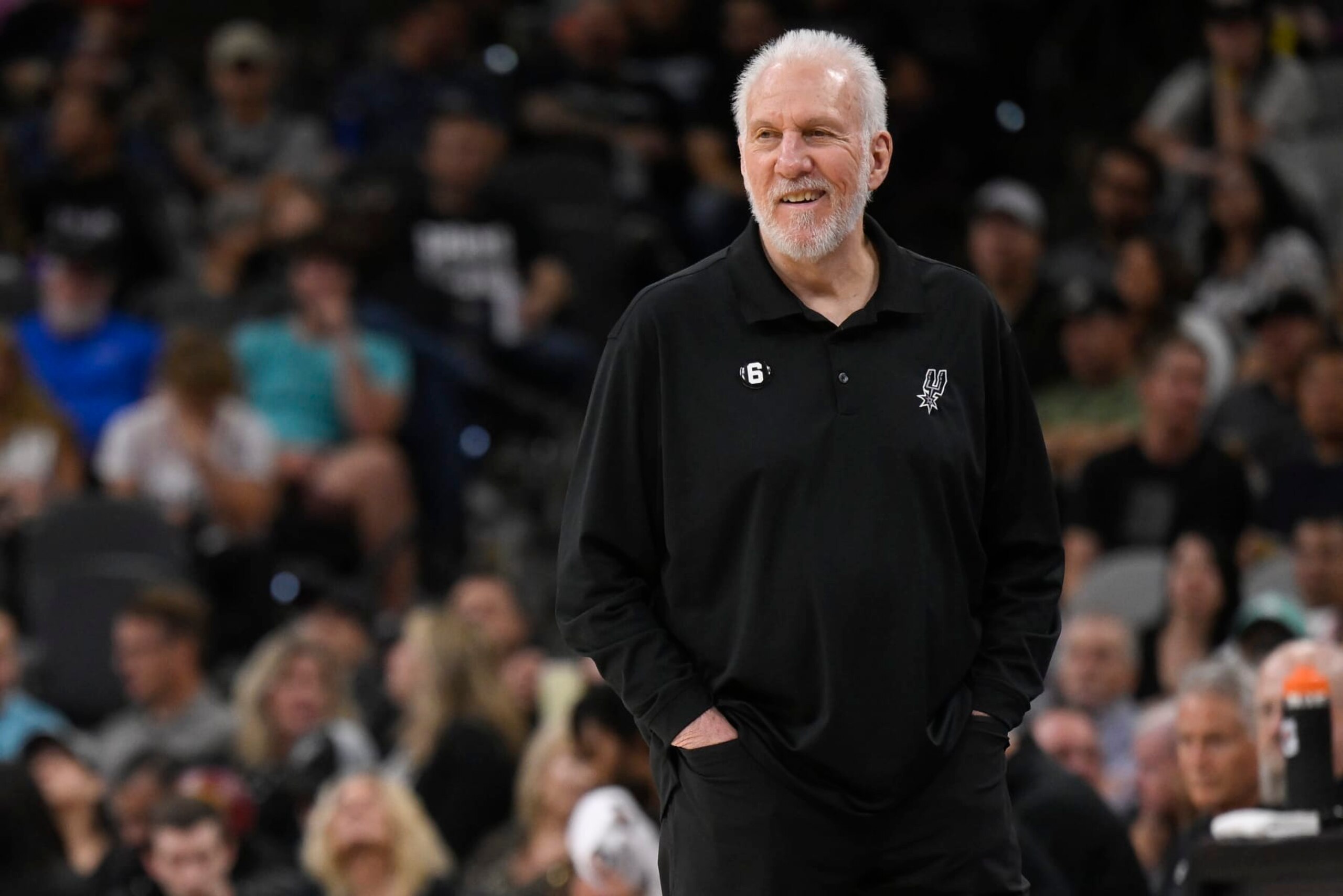 San Antonio Spurs head coach Gregg Popovich watches game action during the first half of an NBA basketball game against the Denver Nuggets, Monday, Nov. 7, 2022, in San Antonio. (AP Photo/Darren Abate)