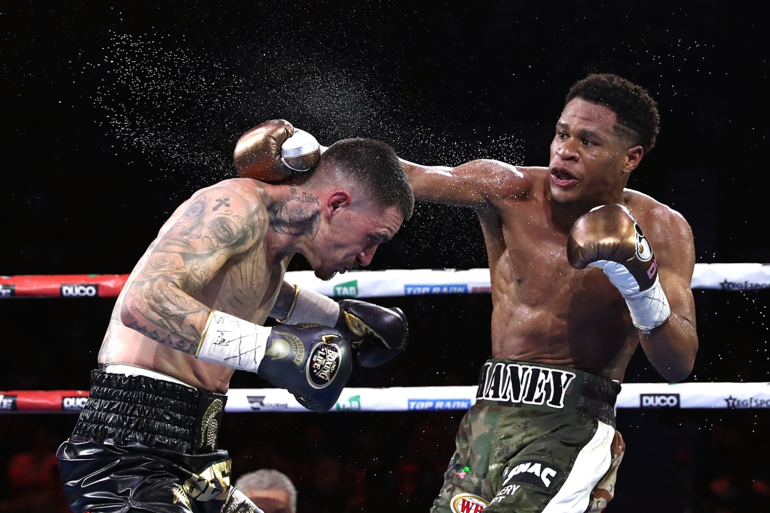 MELBOURNE, AUSTRALIA - OCTOBER 16: Devin Haney and George Kambosos Jr. exchange punches during their World Lightweight Undisputed Championship bout between George Kambosos Jr. of Australia and Devin Haney of the United States at Rod Laver Arena on October 16, 2022 in Melbourne, Australia. (Photo by Kelly Defina/Getty Images) MELBOURNE, AUSTRALIA - OCTOBER 16: Devin Haney and George Kambosos Jr. exchange punches during their World Lightweight Undisputed Championship bout between George Kambosos Jr. of Australia and Devin Haney of the United States at Rod Laver Arena on October 16, 2022 in Melbourne, Australia. (Photo by Kelly Defina/Getty Images)