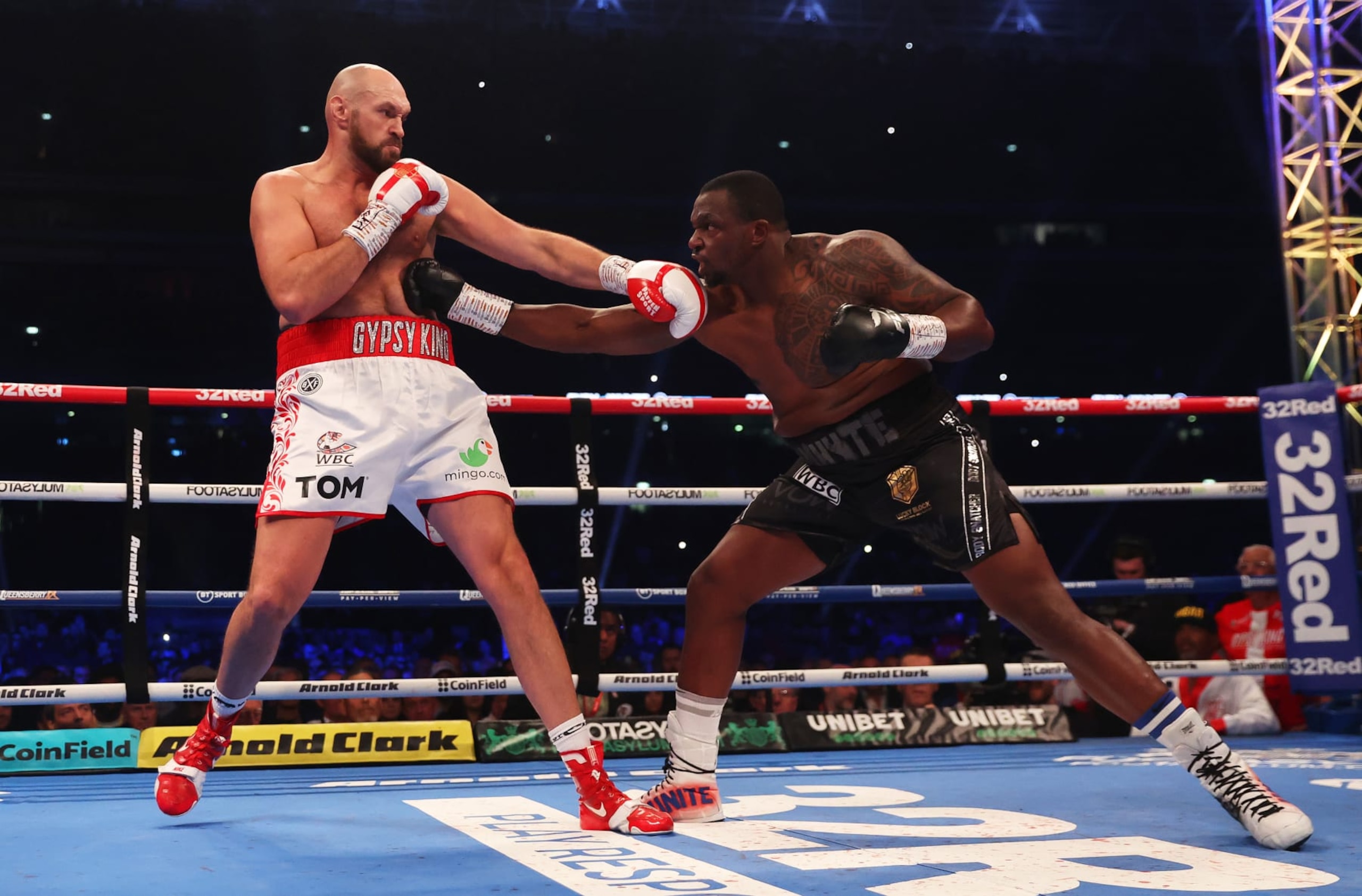 LONDON, ENGLAND - APRIL 23: Dillian Whyte punches Tyson Fury during the WBC World Heavyweight Title Fight between Tyson Fury and Dillian Whyte at Wembley Stadium on April 23, 2022 in London, England. (Photo by Julian Finney/Getty Images) LONDON, ENGLAND - APRIL 23: Dillian Whyte punches Tyson Fury during the WBC World Heavyweight Title Fight between Tyson Fury and Dillian Whyte at Wembley Stadium on April 23, 2022 in London, England. (Photo by Julian Finney/Getty Images)