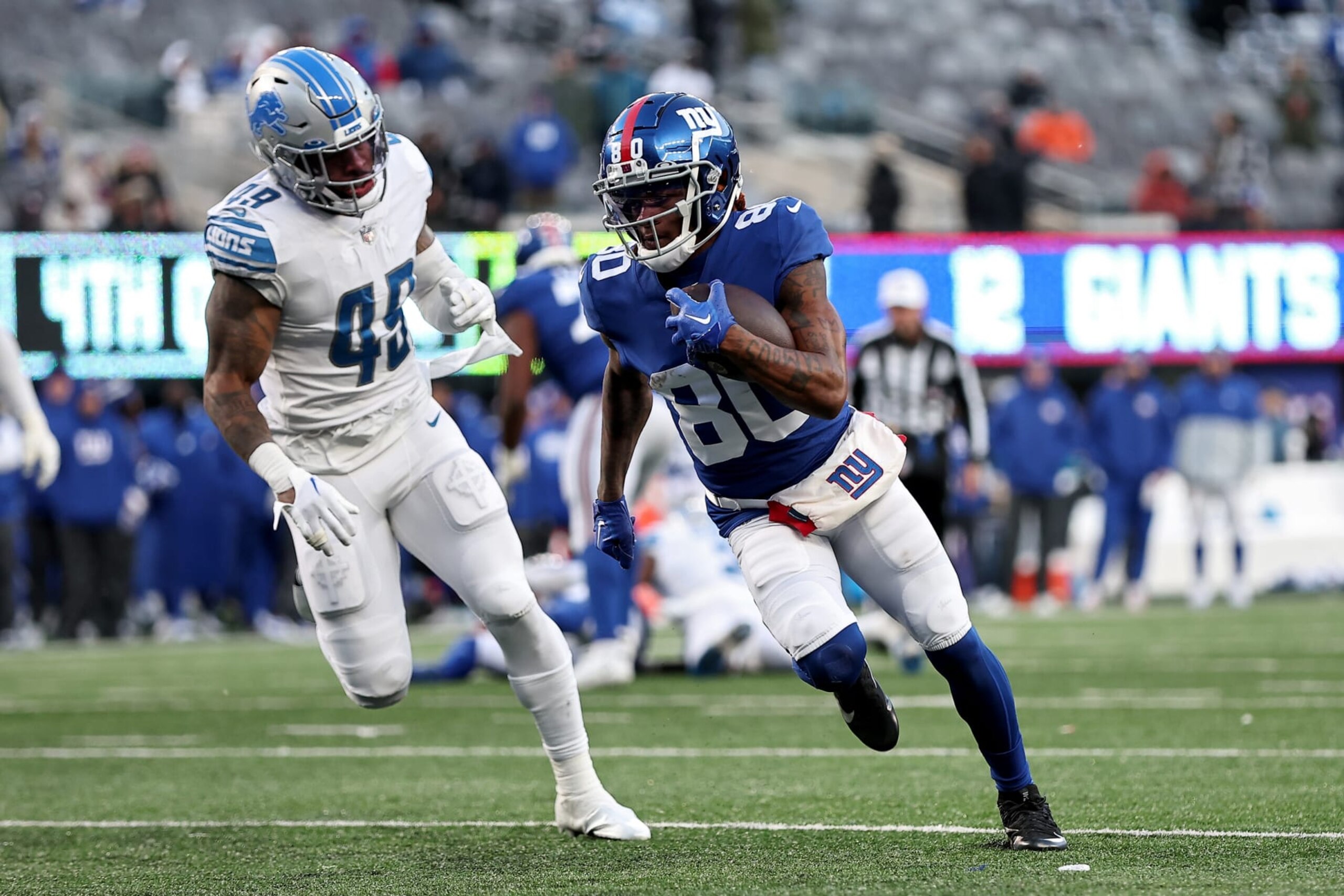 EAST RUTHERFORD, NEW JERSEY - NOVEMBER 20: Richie James #80 of the New York Giants scores a touchdown against the Detroit Lions during the fourth quarter at MetLife Stadium on November 20, 2022 in East Rutherford, New Jersey. (Photo by Dustin Satloff/Getty Images) EAST RUTHERFORD, NEW JERSEY - NOVEMBER 20: Richie James #80 of the New York Giants scores a touchdown against the Detroit Lions during the fourth quarter at MetLife Stadium on November 20, 2022 in East Rutherford, New Jersey. (Photo by Dustin Satloff/Getty Images)