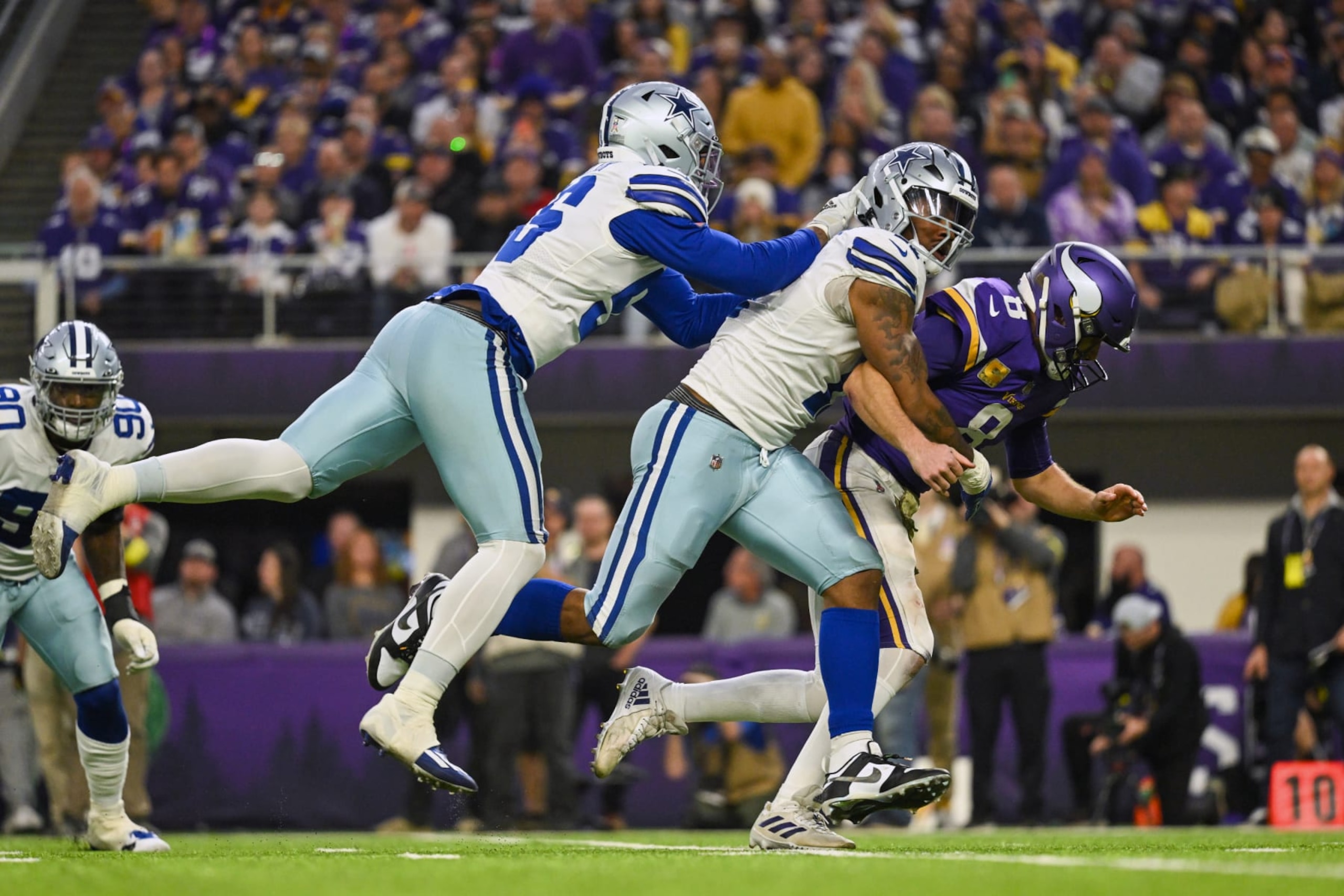 MINNEAPOLIS, MN - NOVEMBER 20: Dallas Cowboys defensive end Dante Fowler (56) and Dallas Cowboys linebacker Micah Parsons (11) hit Minnesota Vikings quarterback Kirk Cousins (8) as he throws the ball during the second quarter of a game between the Minnesota Vikings and Dallas Cowboys on November 20, 2022, at U.S. Bank Stadium in Minneapolis, MN.(Photo by Nick Wosika/Icon Sportswire via Getty Images) MINNEAPOLIS, MN - NOVEMBER 20: Dallas Cowboys defensive end Dante Fowler (56) and Dallas Cowboys linebacker Micah Parsons (11) hit Minnesota Vikings quarterback Kirk Cousins (8) as he throws the ball during the second quarter of a game between the Minnesota Vikings and Dallas Cowboys on November 20, 2022, at U.S. Bank Stadium in Minneapolis, MN.(Photo by Nick Wosika/Icon Sportswire via Getty Images)