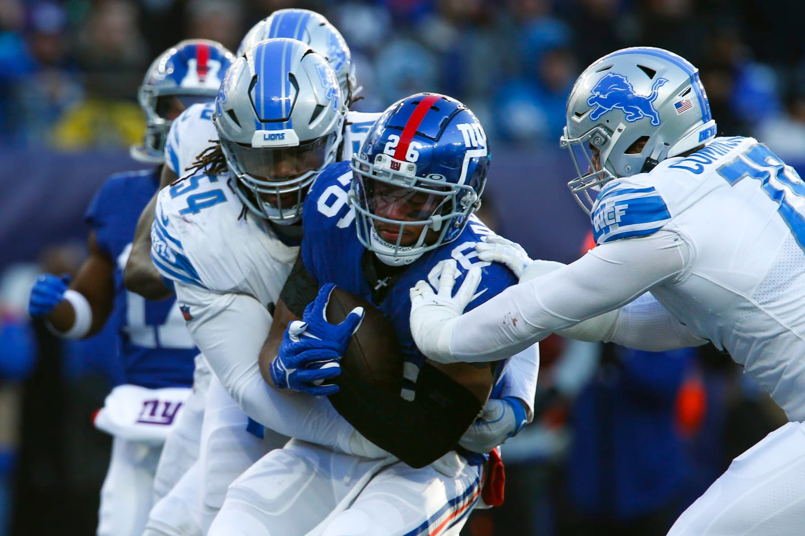 New York Giants running back Saquon Barkley (26) runs the ball against Detroit Lions defensive tackle Alim McNeill (54) during the second half of an NFL football game, Sunday, Nov. 20, 2022, in East Rutherford, N.J. (AP Photo/John Munson) New York Giants running back Saquon Barkley (26) runs the ball against Detroit Lions defensive tackle Alim McNeill (54) during the second half of an NFL football game, Sunday, Nov. 20, 2022, in East Rutherford, N.J. (AP Photo/John Munson)