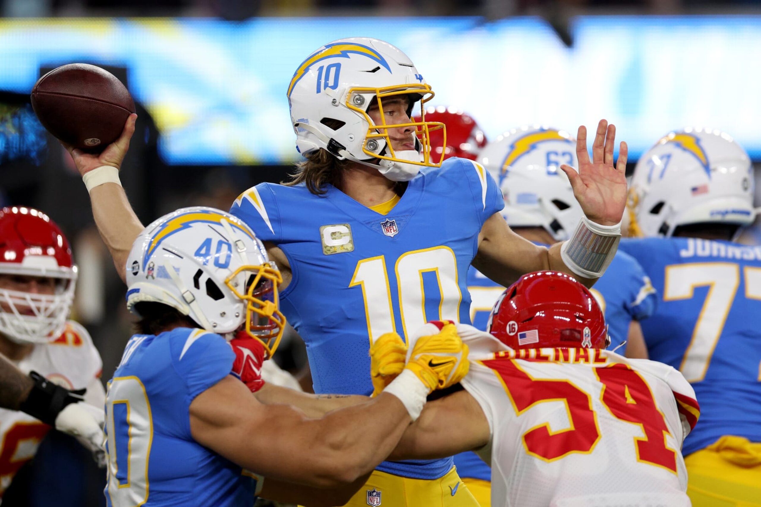 INGLEWOOD, CALIFORNIA - NOVEMBER 20: Justin Herbert #10 of the Los Angeles Chargers throws a pass during the first quarter in the game against the Kansas City Chiefs at SoFi Stadium on November 20, 2022 in Inglewood, California. (Photo by Harry How/Getty Images)