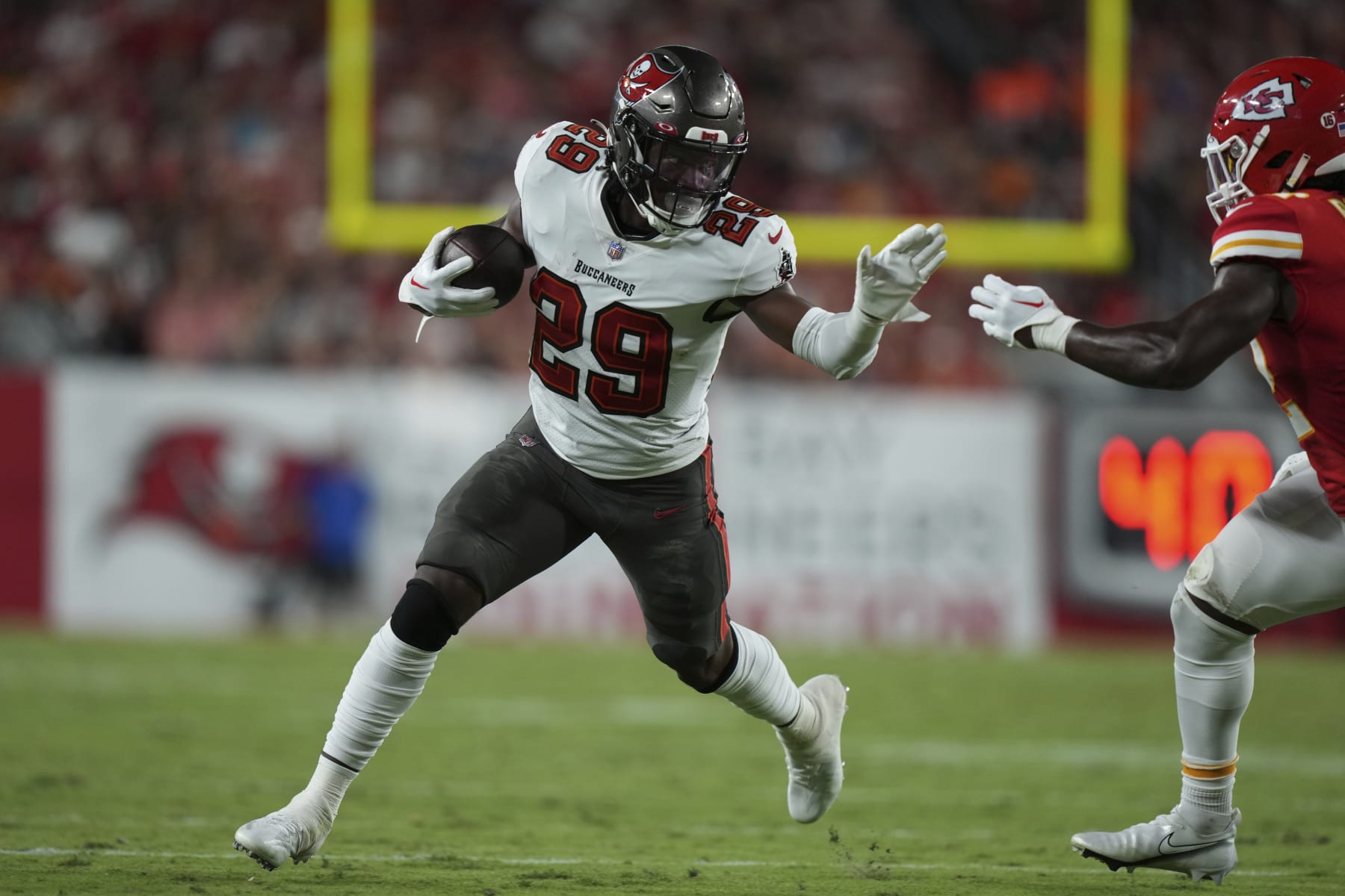 Tampa Bay Buccaneers running back Rachaad White (29) finds running room on the edge during an NFL football game against the ,Kansas City Chiefs Sunday, Oct. 2, 2022 in Tampa, Fla. The Chiefs defeat the Buccaneers 41-31. (AP Photo/Peter Joneleit)