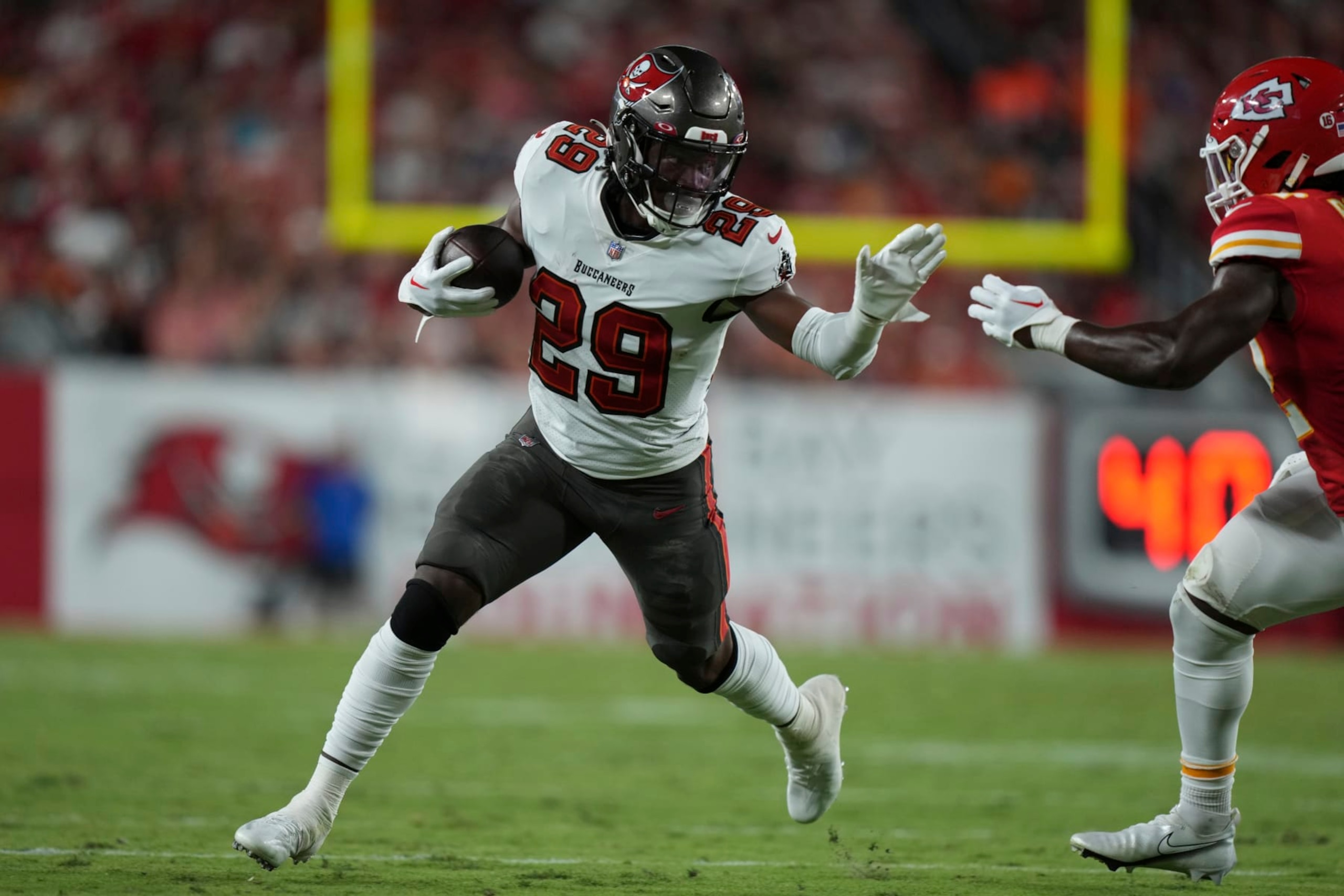 Tampa Bay Buccaneers running back Rachaad White (29) finds running room on the edge during an NFL football game against the ,Kansas City Chiefs Sunday, Oct. 2, 2022 in Tampa, Fla. The Chiefs defeat the Buccaneers 41-31. (AP Photo/Peter Joneleit) Tampa Bay Buccaneers running back Rachaad White (29) finds running room on the edge during an NFL football game against the ,Kansas City Chiefs Sunday, Oct. 2, 2022 in Tampa, Fla. The Chiefs defeat the Buccaneers 41-31. (AP Photo/Peter Joneleit)