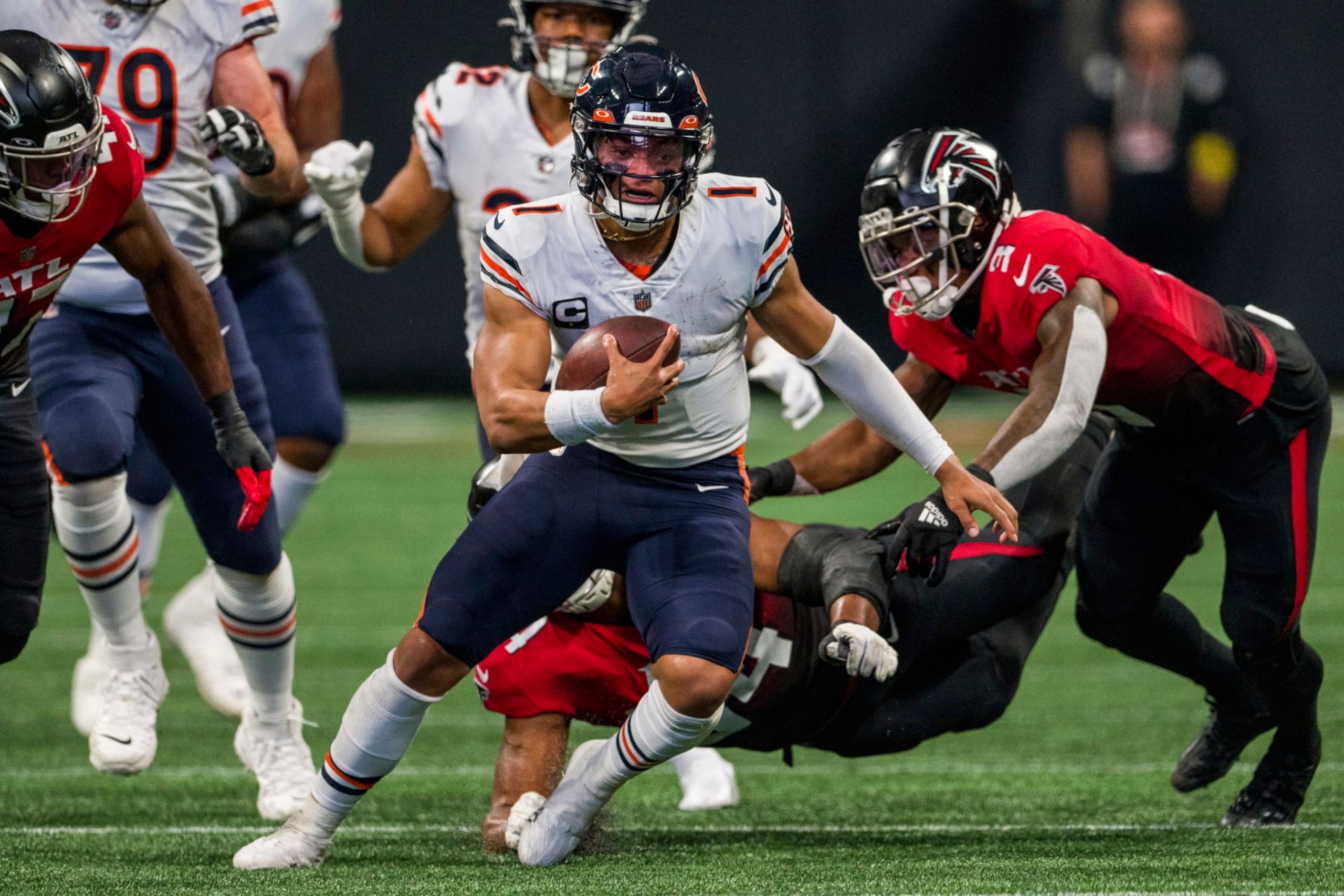 Chicago Bears quarterback Justin Fields (1) runs the ball during the first half of an NFL football game against the Atlanta Falcons, Sunday, Nov. 20, 2022, in Atlanta. (AP Photo/Danny Karnik) Chicago Bears quarterback Justin Fields (1) runs the ball during the first half of an NFL football game against the Atlanta Falcons, Sunday, Nov. 20, 2022, in Atlanta. (AP Photo/Danny Karnik)