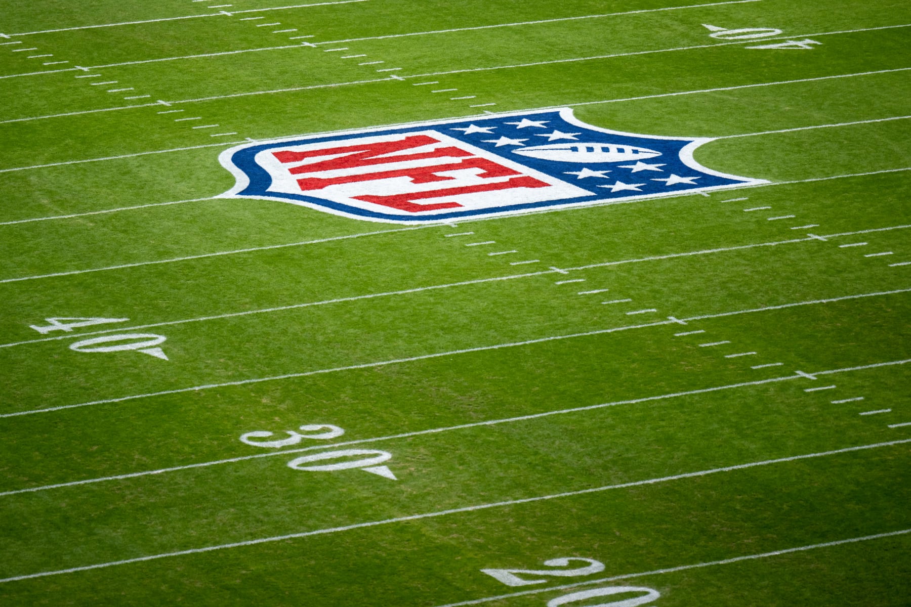 MUNICH, GERMANY - NOVEMBER 13: The NFL logo is painted on the field prior to the NFL match between Seattle Seahawks and Tampa Bay Buccaneers at Allianz Arena on November 13, 2022 in Munich, Germany. (Photo by Sebastian Widmann/Getty Images)