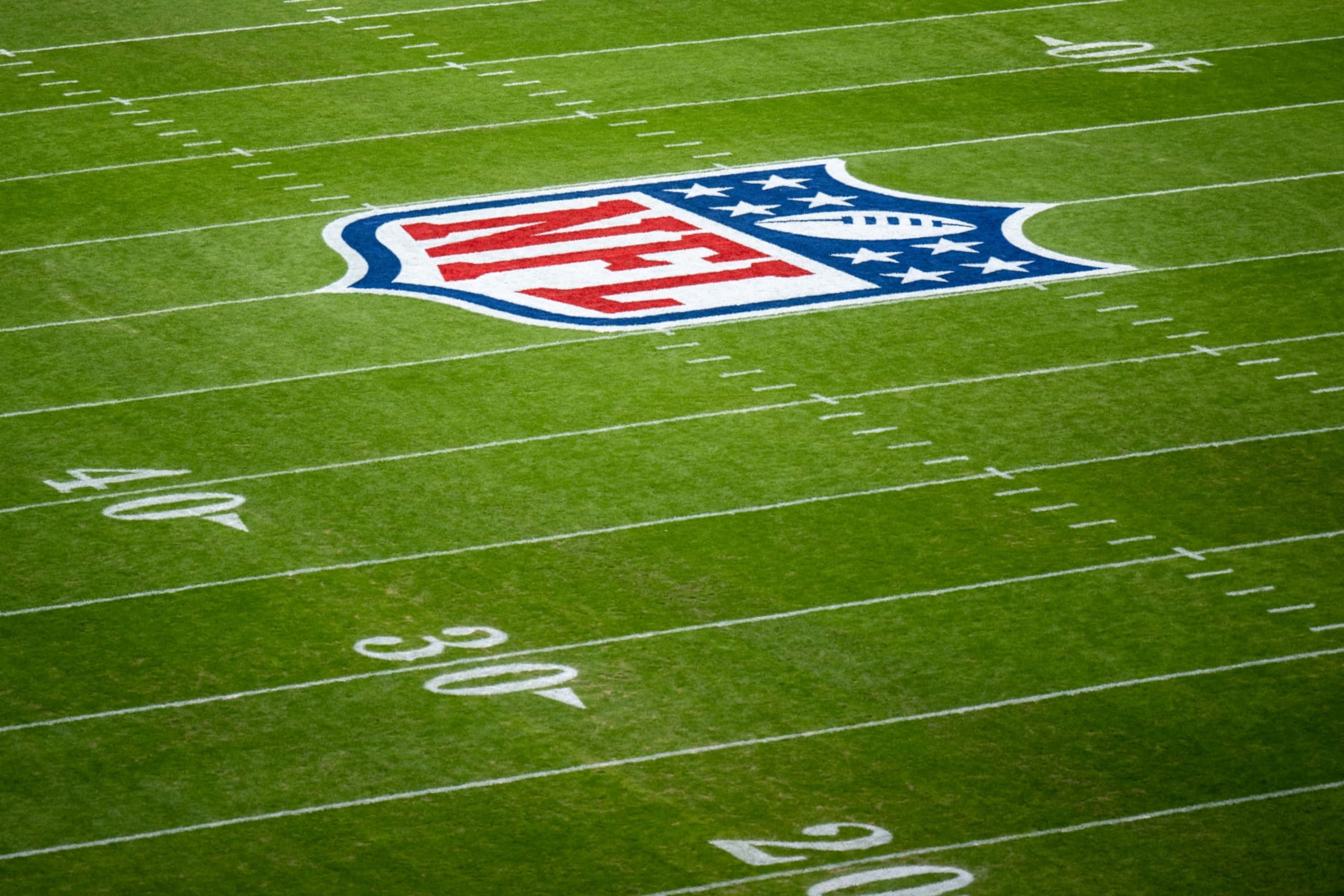 MUNICH, GERMANY - NOVEMBER 13: The NFL logo is painted on the field prior to the NFL match between Seattle Seahawksย and Tampa Bay Buccaneers at Allianz Arena on November 13, 2022 in Munich, Germany. (Photo by Sebastian Widmann/Getty Images) MUNICH, GERMANY - NOVEMBER 13: The NFL logo is painted on the field prior to the NFL match between Seattle Seahawksย and Tampa Bay Buccaneers at Allianz Arena on November 13, 2022 in Munich, Germany. (Photo by Sebastian Widmann/Getty Images)