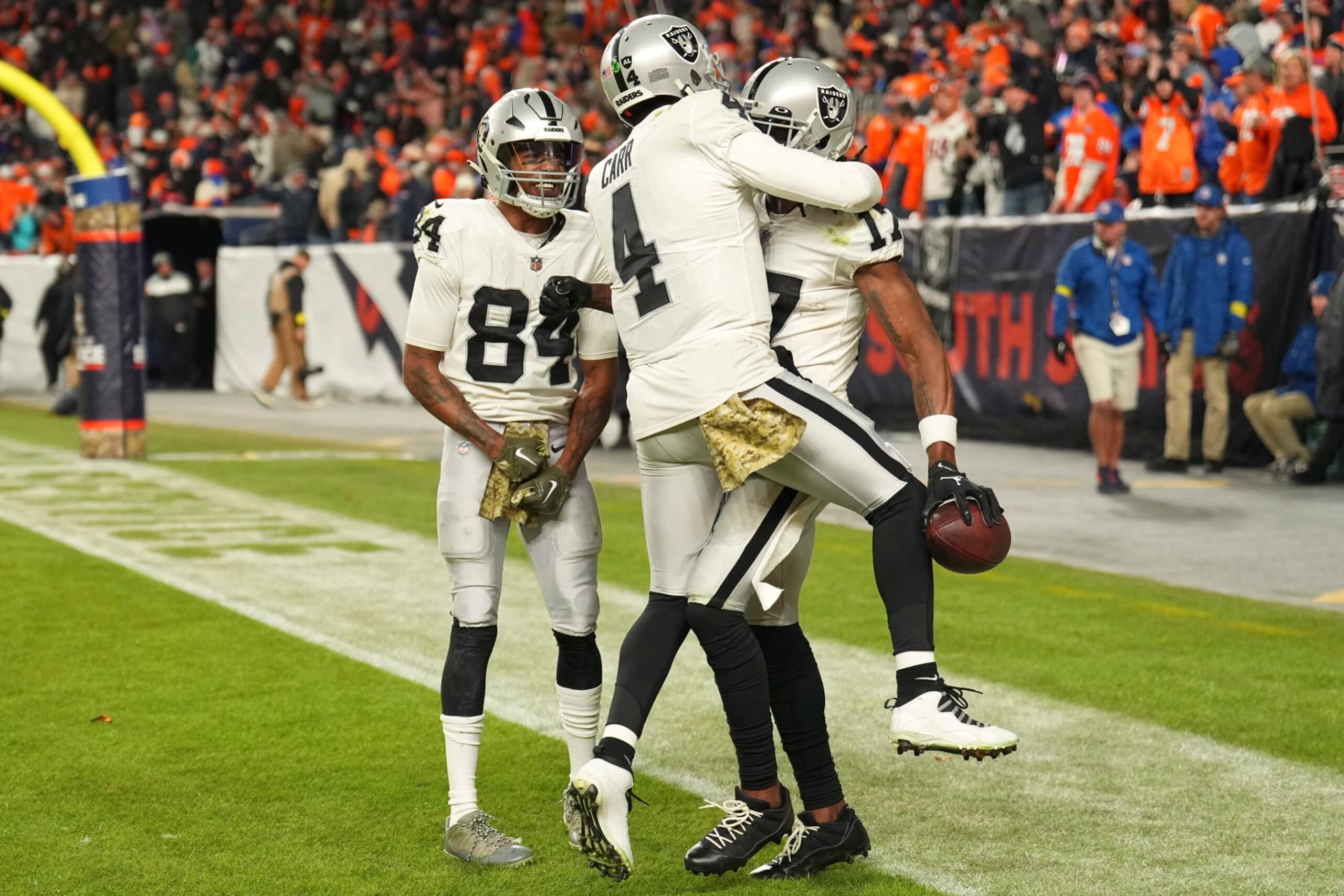 Las Vegas Raiders quarterback Derek Carr (4) celebrates with wide receiver Davante Adams, right, and wide receiver Keelan Cole (84) after Adams scored the winning touchdown during overtime of an NFL football game against the Denver Broncos in Denver, Sunday, Nov. 20, 2022. (AP Photo/Jack Dempsey) Las Vegas Raiders quarterback Derek Carr (4) celebrates with wide receiver Davante Adams, right, and wide receiver Keelan Cole (84) after Adams scored the winning touchdown during overtime of an NFL football game against the Denver Broncos in Denver, Sunday, Nov. 20, 2022. (AP Photo/Jack Dempsey)