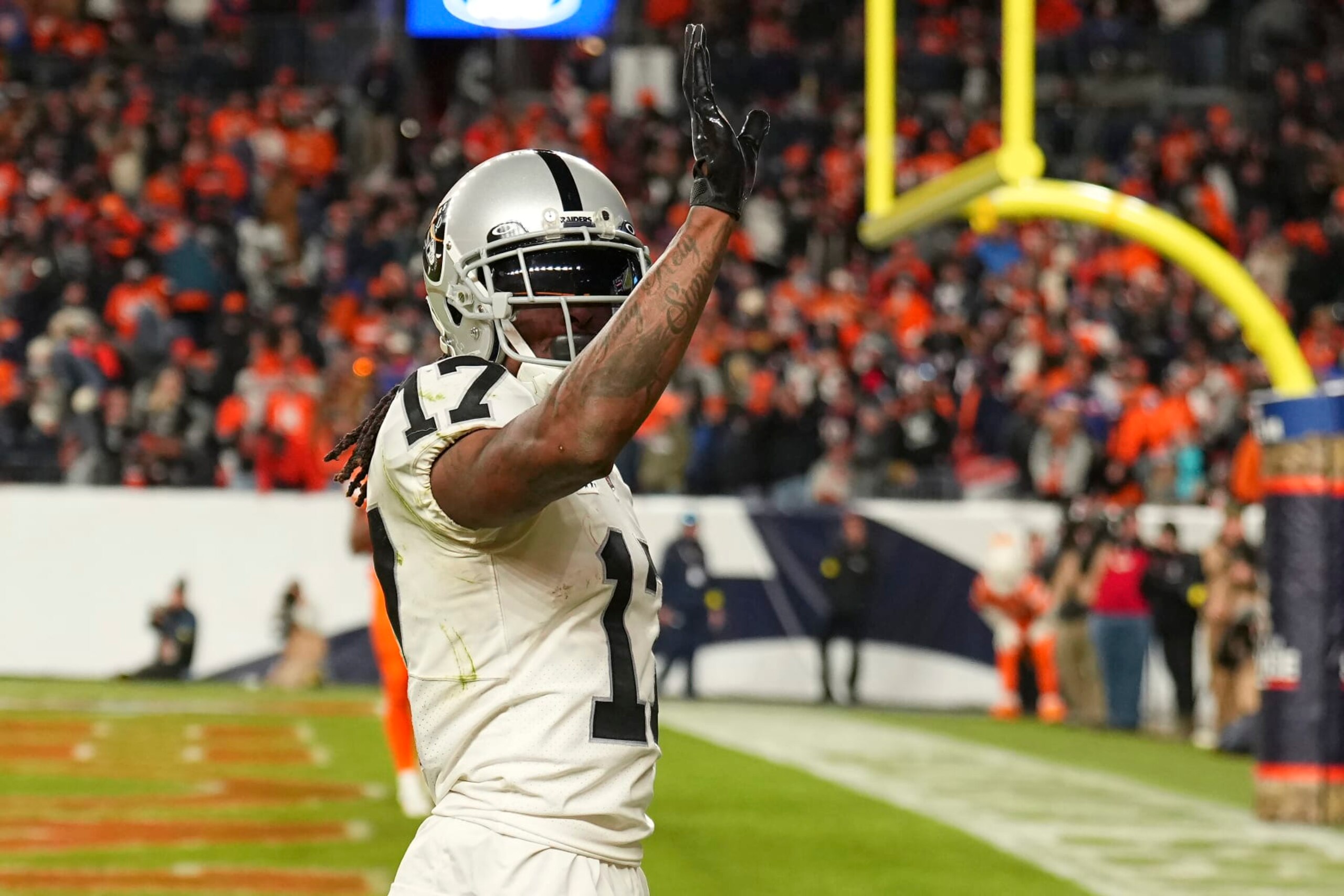 Las Vegas Raiders wide receiver Davante Adams (17) waves after scoring the winning touchdown against the Denver Broncos during overtime of an NFL football game in Denver, Sunday, Nov. 20, 2022. (AP Photo/Jack Dempsey) Las Vegas Raiders wide receiver Davante Adams (17) waves after scoring the winning touchdown against the Denver Broncos during overtime of an NFL football game in Denver, Sunday, Nov. 20, 2022. (AP Photo/Jack Dempsey)