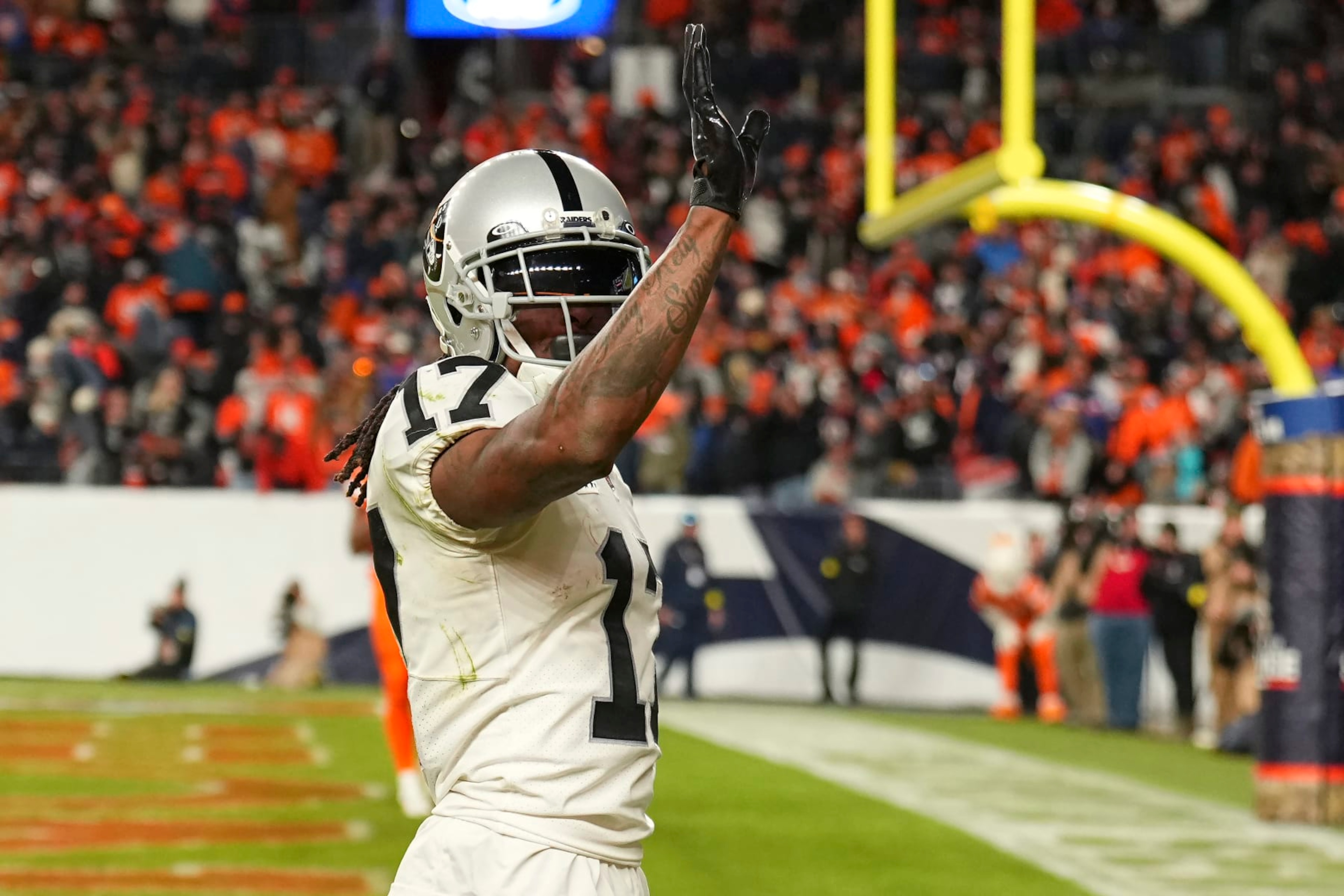 Las Vegas Raiders wide receiver Davante Adams (17) waves after scoring the winning touchdown against the Denver Broncos during overtime of an NFL football game in Denver, Sunday, Nov. 20, 2022. (AP Photo/Jack Dempsey) Las Vegas Raiders wide receiver Davante Adams (17) waves after scoring the winning touchdown against the Denver Broncos during overtime of an NFL football game in Denver, Sunday, Nov. 20, 2022. (AP Photo/Jack Dempsey)