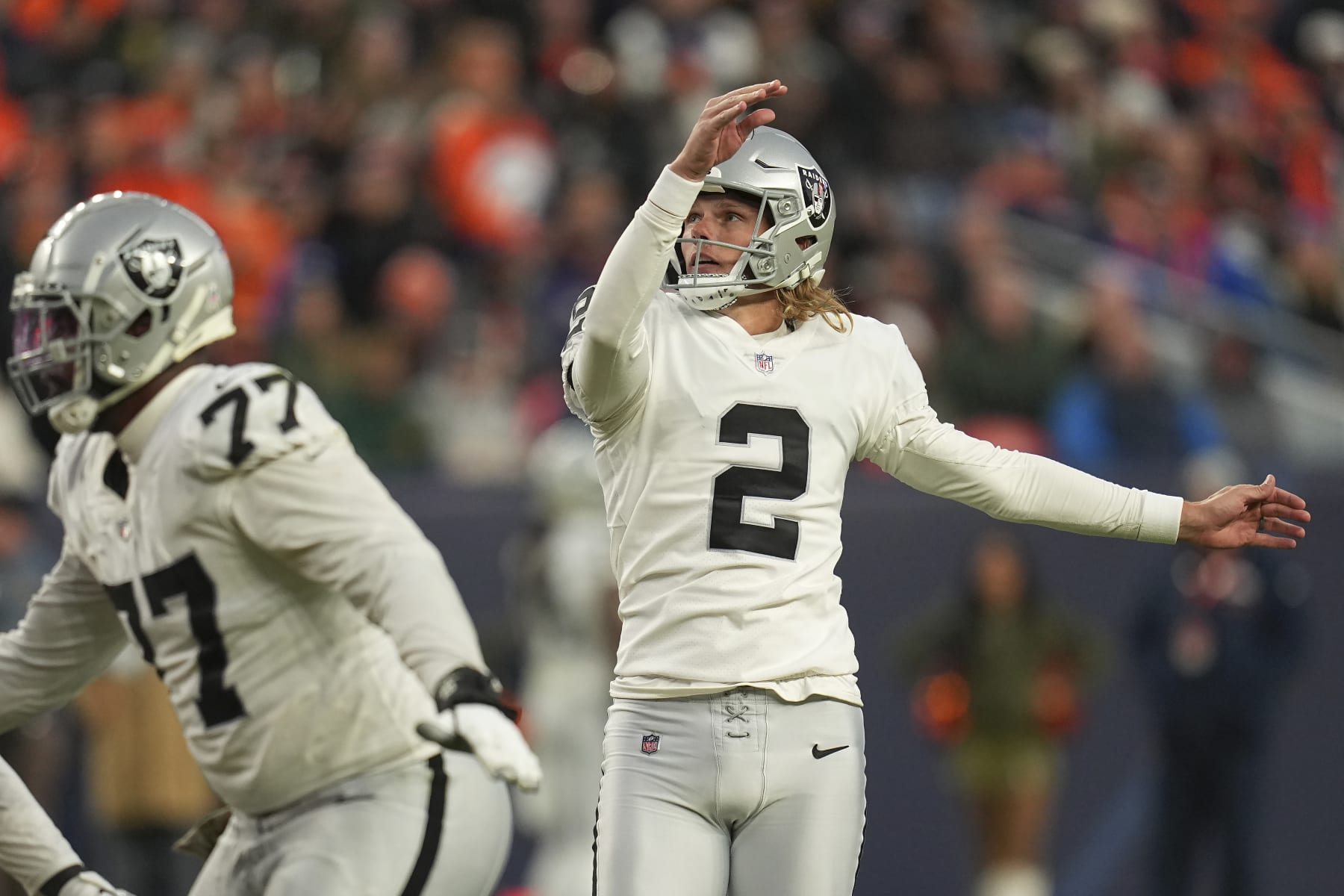 Las Vegas Raiders place kicker Daniel Carlson (2) watches his field goal during the second half of an NFL football game against the Denver Broncos in Denver, Sunday, Nov. 20, 2022. (AP Photo/Jack Dempsey)